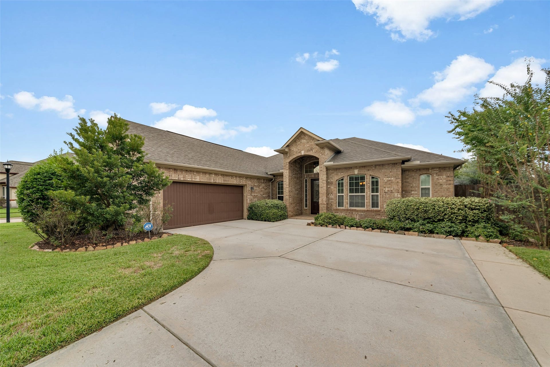 12218 Rampy Green Drive, Tomball, TX 77377 Charming single-story brick home on a corner lot with a spacious driveway and no backyard neighbors.