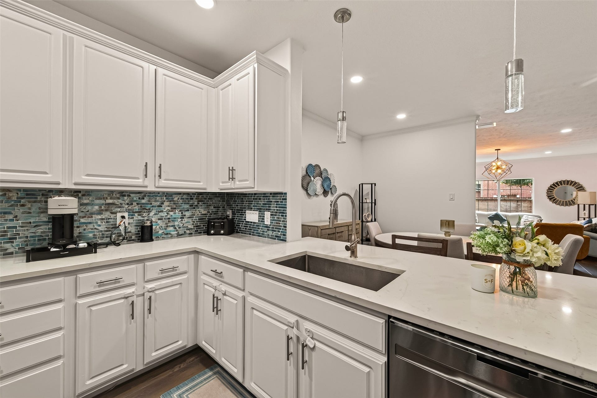 2865 Westhollow Drive, #43, Houston, TX 77082 Crisp white cabinetry paired with stylish modern tile work for maximum storage and beauty.