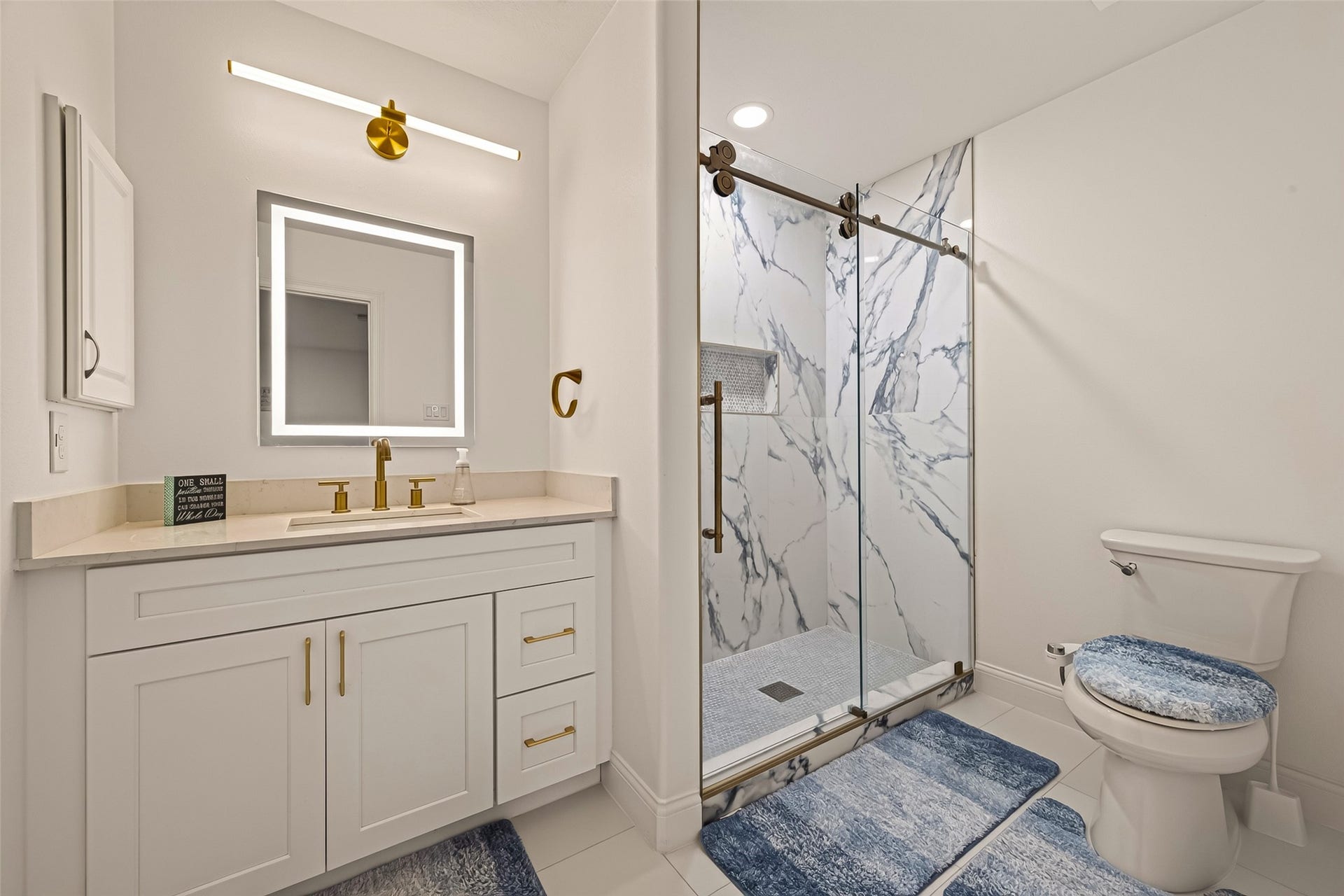2865 Westhollow Drive, #43, Houston, TX 77082 Sleek full bath with modern vanity finishes and a crisp, seamless glass shower enclosure.