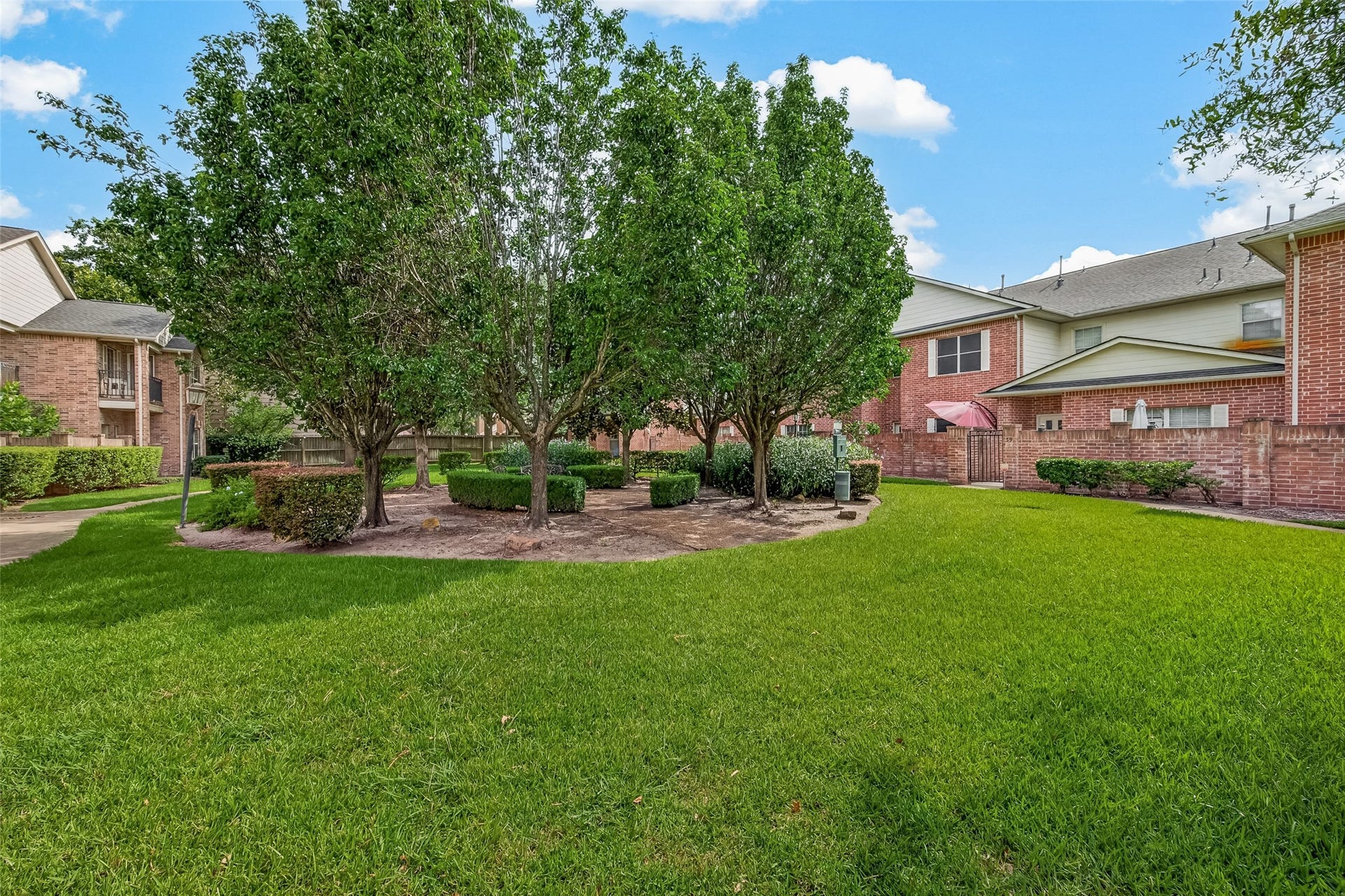 2865 Westhollow Drive, #43, Houston, TX 77082 Lush green lawns and mature shade trees create a serene, park-like setting right outside your door.