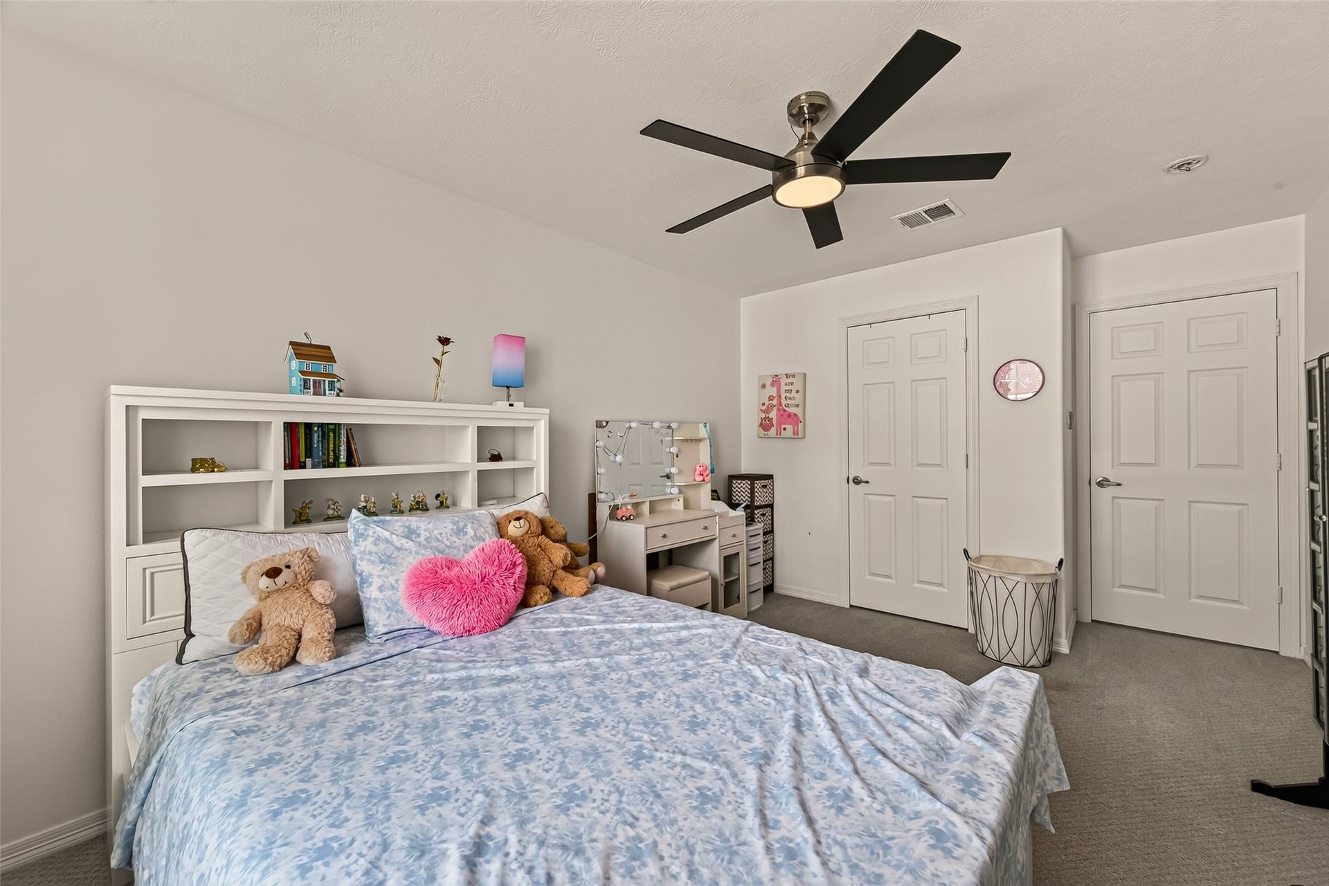 2865 Westhollow Drive, #43, Houston, TX 77082 Cozy retreat with built-in storage and a refreshing ceiling fan for comfortable year-round living.