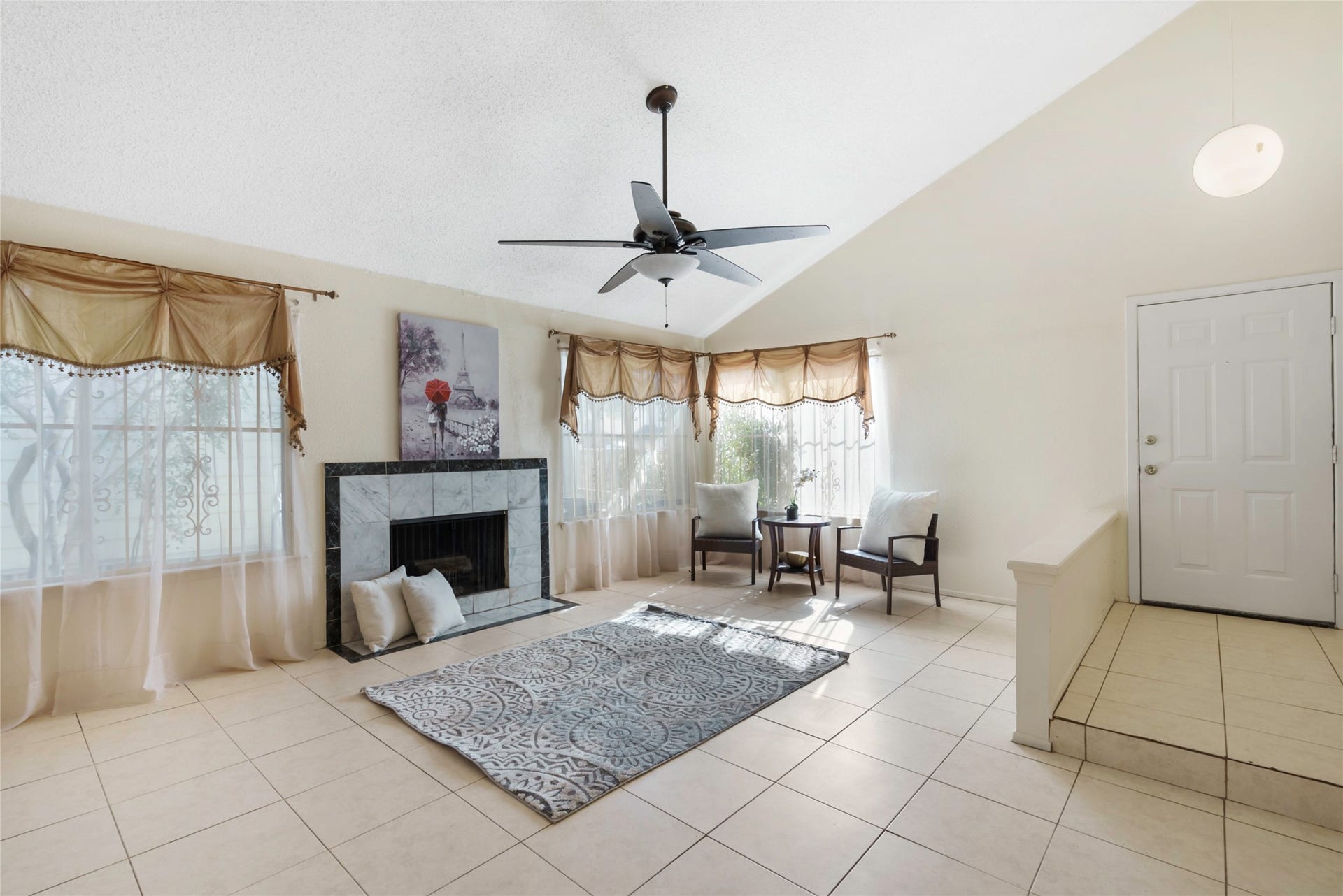 Imagine all the memories you will make as you gather with loved ones around this fireplace! High ceilings and plenty of windows create an open and airy feel in this space!