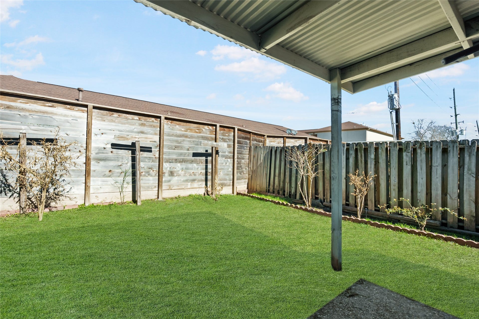 The backyard is easy to maintain and has a covered porch!
