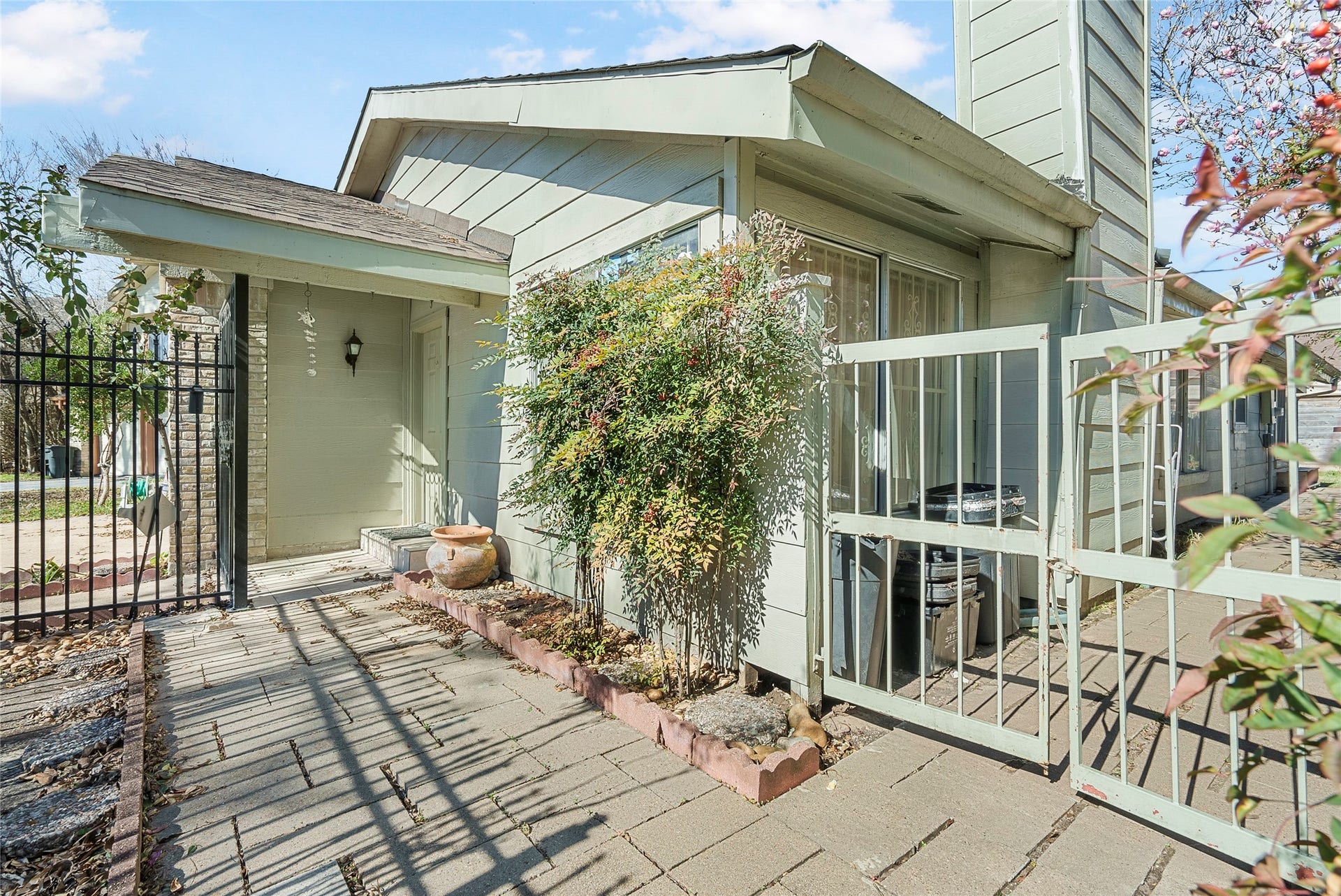 Character-filled details are found throughout! This courtyard is right in front of the home, and allows a great place to relax and chat with neighbors!