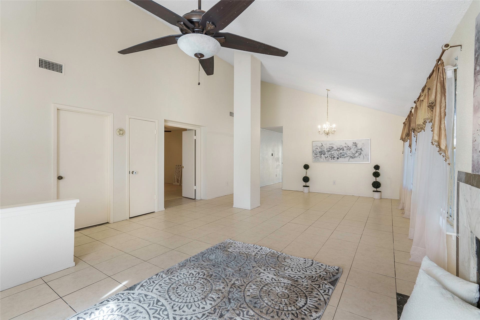 Upon entering you will be amazed with the tile that flows endlessly throughout all the living areas and bedrooms! This home is easy to maintain with NO carpet!