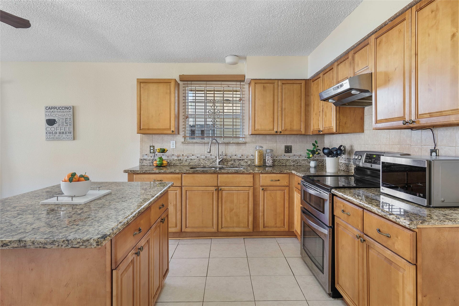 Prepare all your gourmet meals in this lovely space, with expansive counters, loves of cabinets and stainless steel appliances!