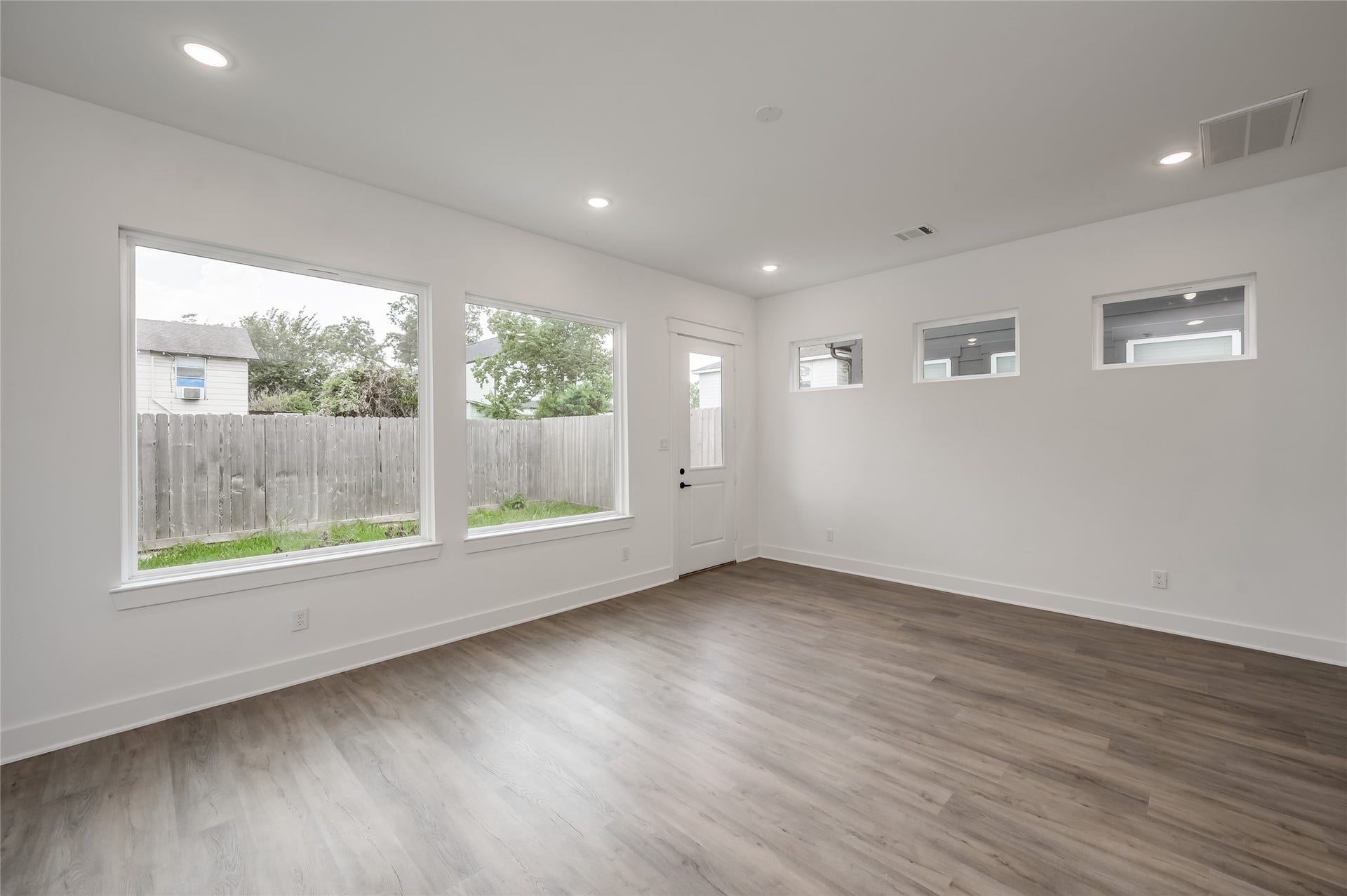 4605 Terry Street, Houston, TX 77009 A wall of windows along the back of the living room fills the space with natural light throughout the day