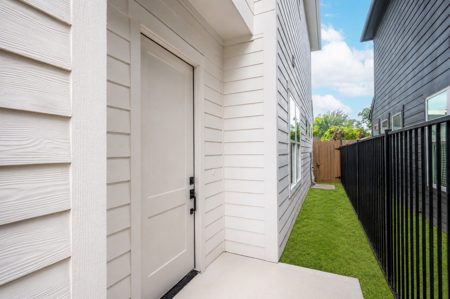 4605 Terry Street, Houston, TX 77009 A tidy walkway leads you to the front door, framed by a fresh fence line that hints at the privacy waiting out back
