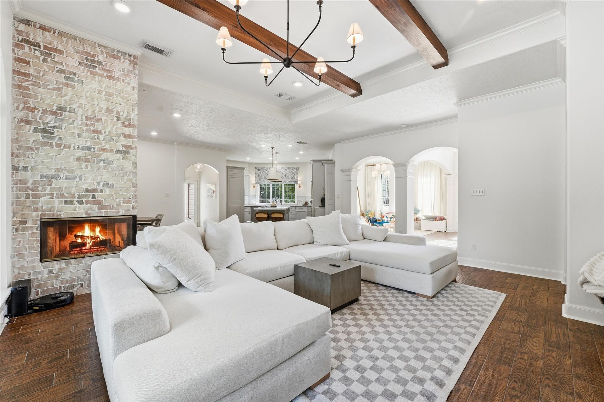 23210 Willowcreek Stables Road, Spring, TX 77389 Wood beams, classic arch ways and a cozy fireplace in the living & dining areas.