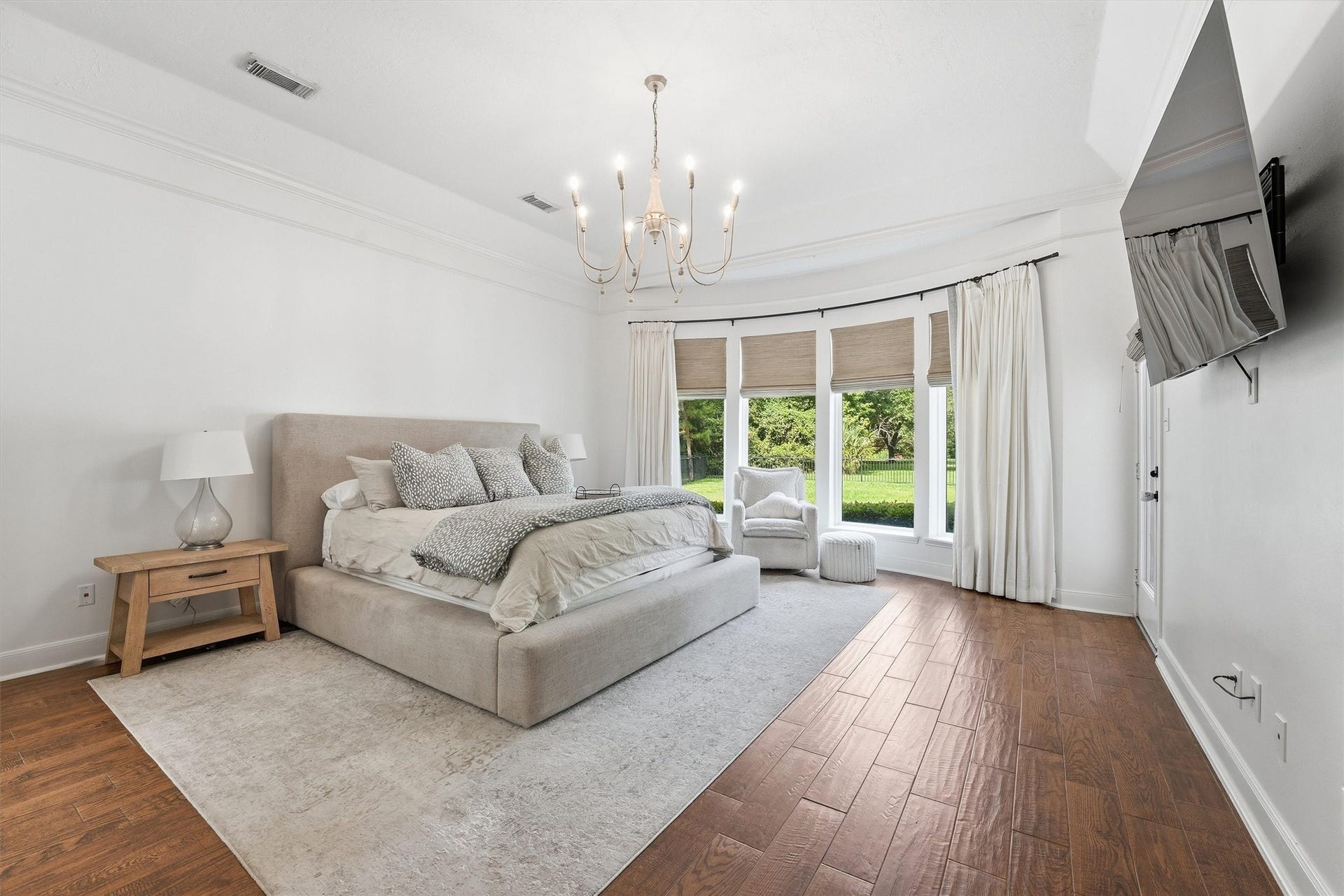 23210 Willowcreek Stables Road, Spring, TX 77389 The Luxurious primary bedroom with sitting area & access to the resort-like backyard.