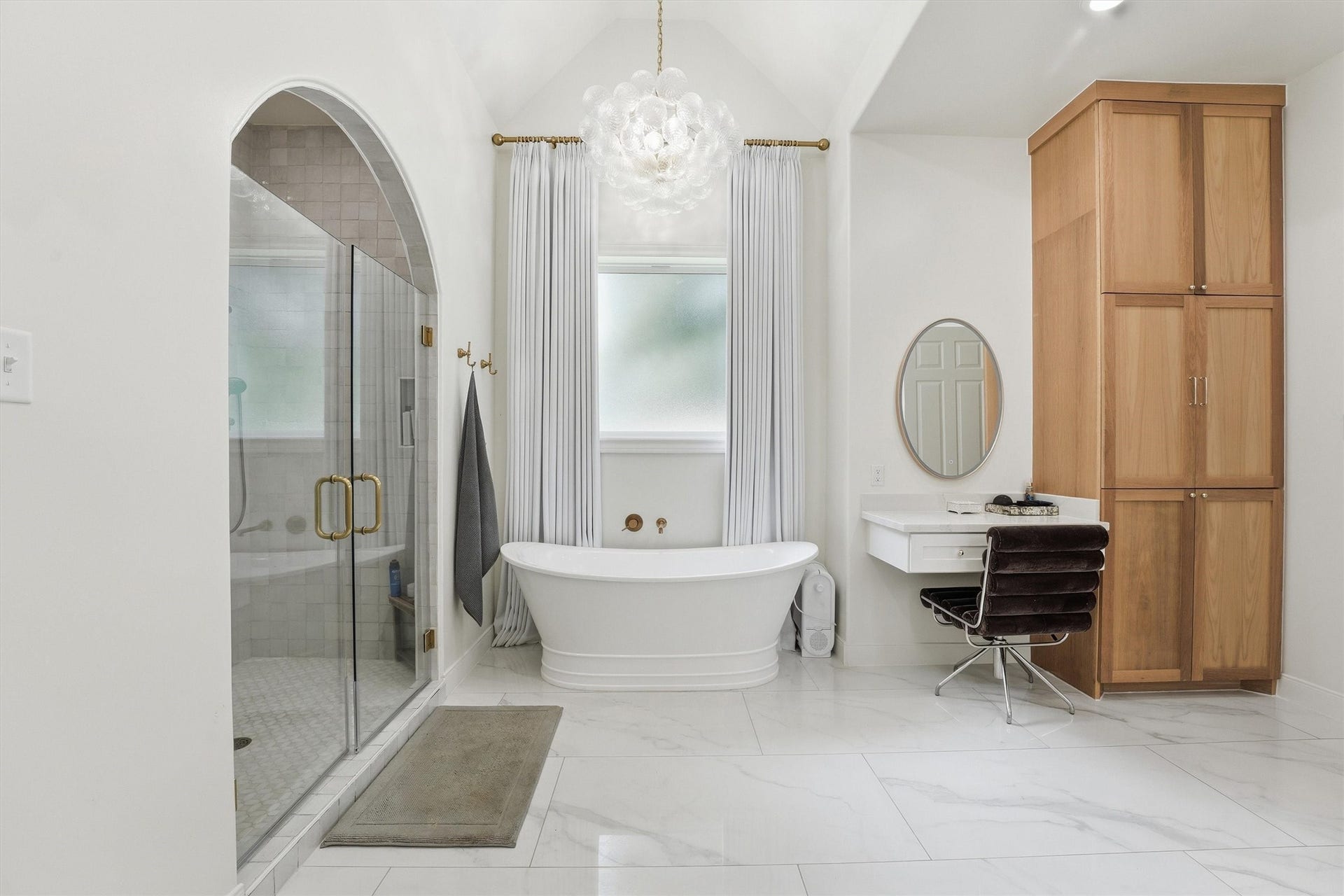 23210 Willowcreek Stables Road, Spring, TX 77389 Spa-inspired primary en suite w/ freestanding tub, walk-in shower, designer lighting & custom cabinetry.