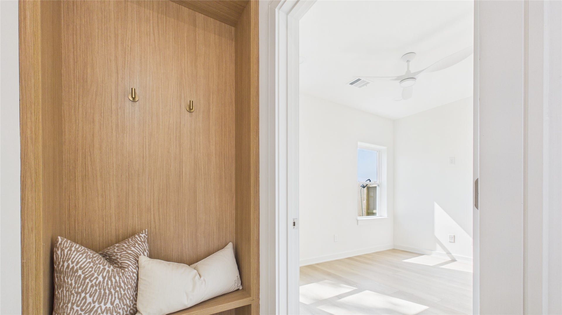 First floor secondary bedroom with a cozy built-in mudroom.
