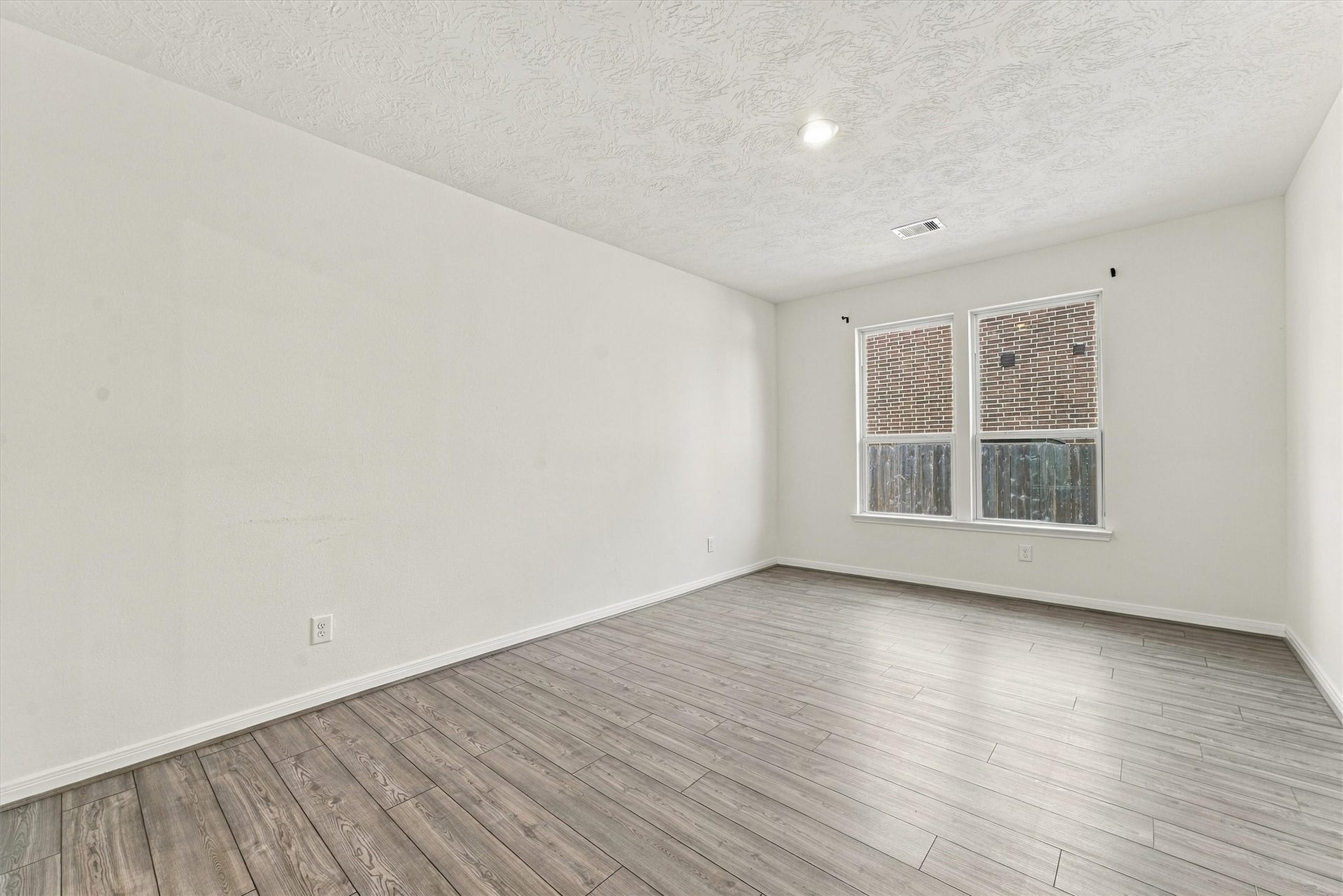 Oversized dining room or flex space for media room, fitness room, or play room.