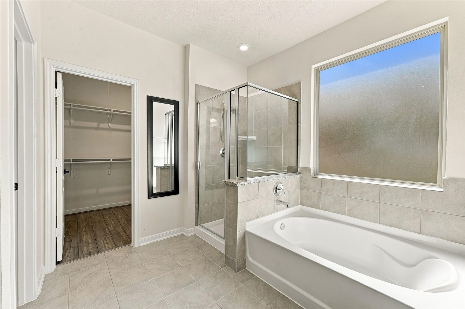 Soaking tub with separate shower