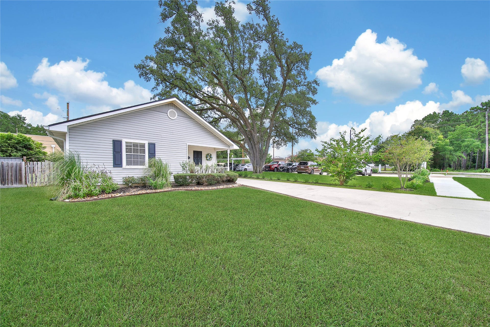 307 Lawrence Street, Tomball, TX 77375 Long concrete driveway is great for extra parking.