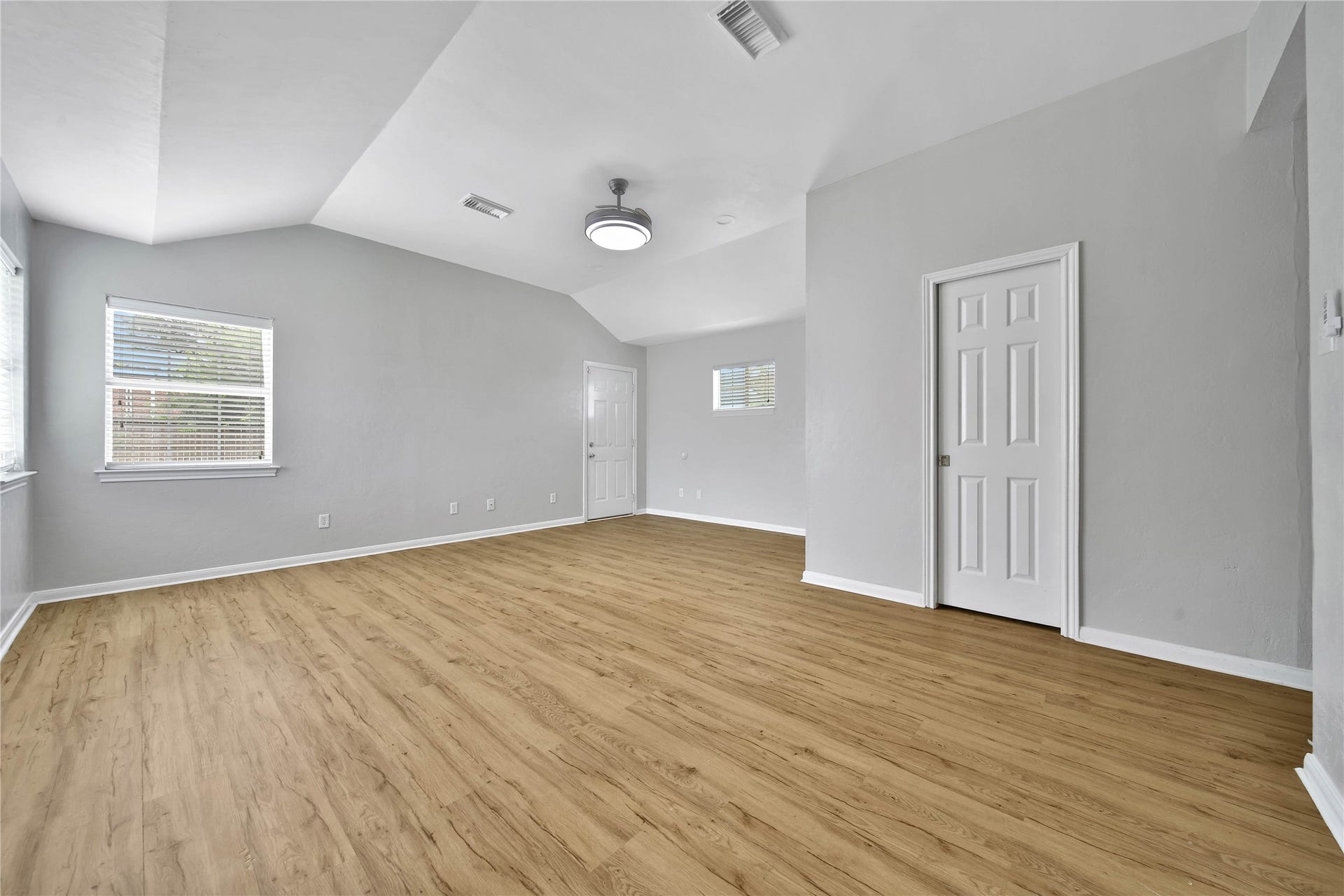 307 Lawrence Street, Tomball, TX 77375 Rear door is access to the patio and garage. Large walk in closet has a pocket door.