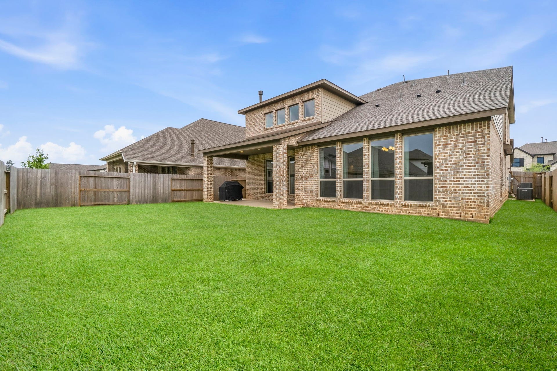 1147 Beals Creek Street, Conroe, TX 77304 The spacious, fully fenced backyard offers plenty of room for outdoor entertaining, play, pets, or even a future pool. *VIRTUALLY ENHANCED