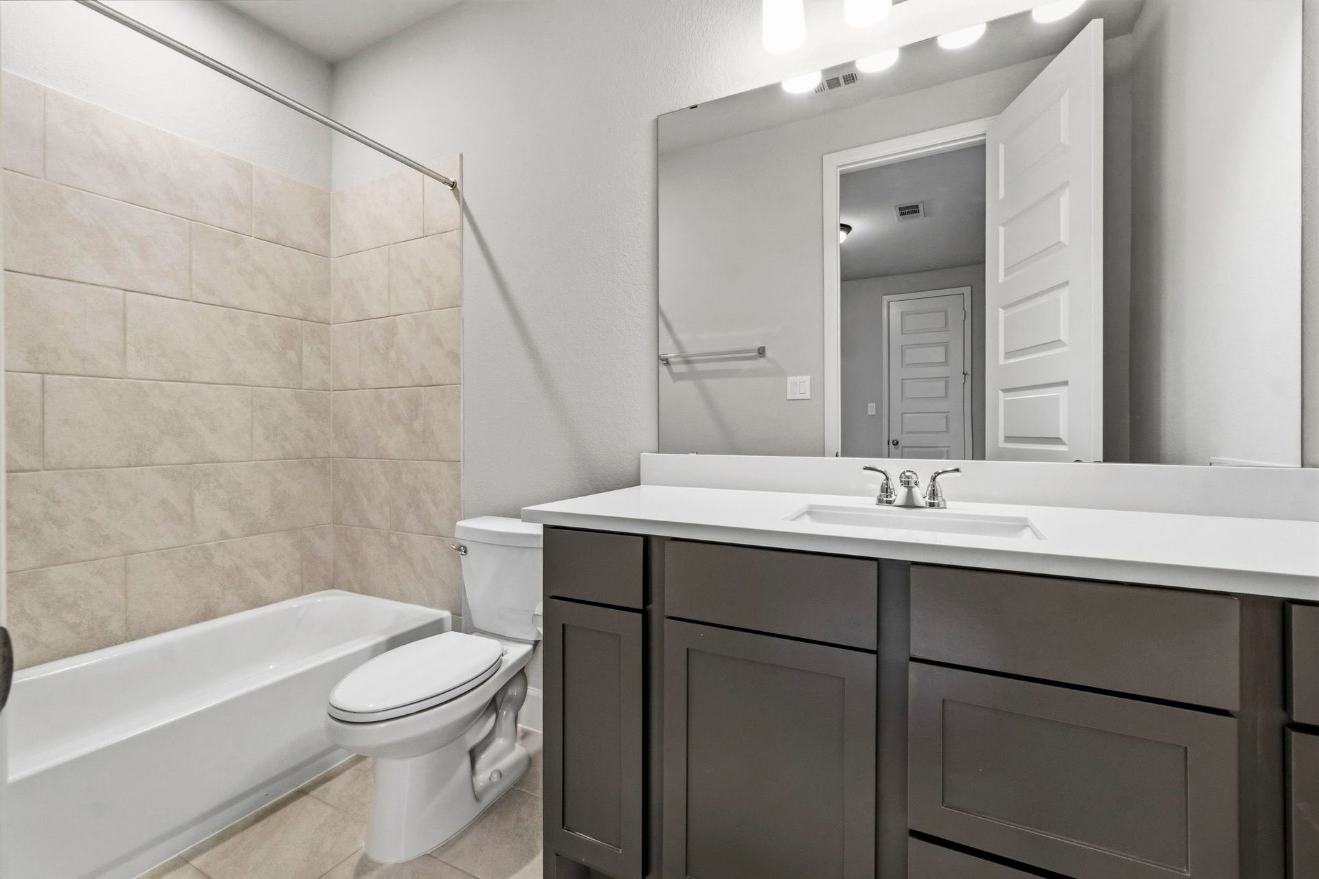 1147 Beals Creek Street, Conroe, TX 77304 A third full bathroom upstairs provides added convenience for the secondary bedrooms, game room, and media room.