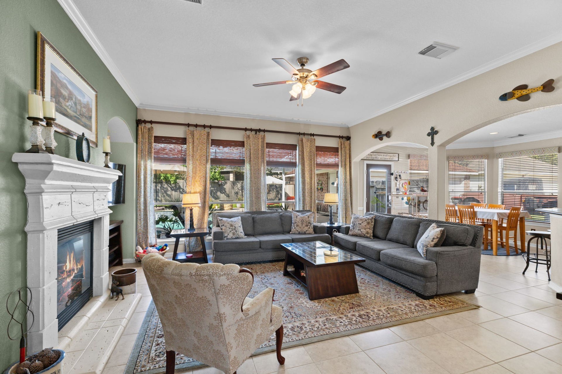16319 Rolling View Trail, Cypress, TX 77433 The family room is open to the kitchen and the wall of window let the room bathe in the sun!