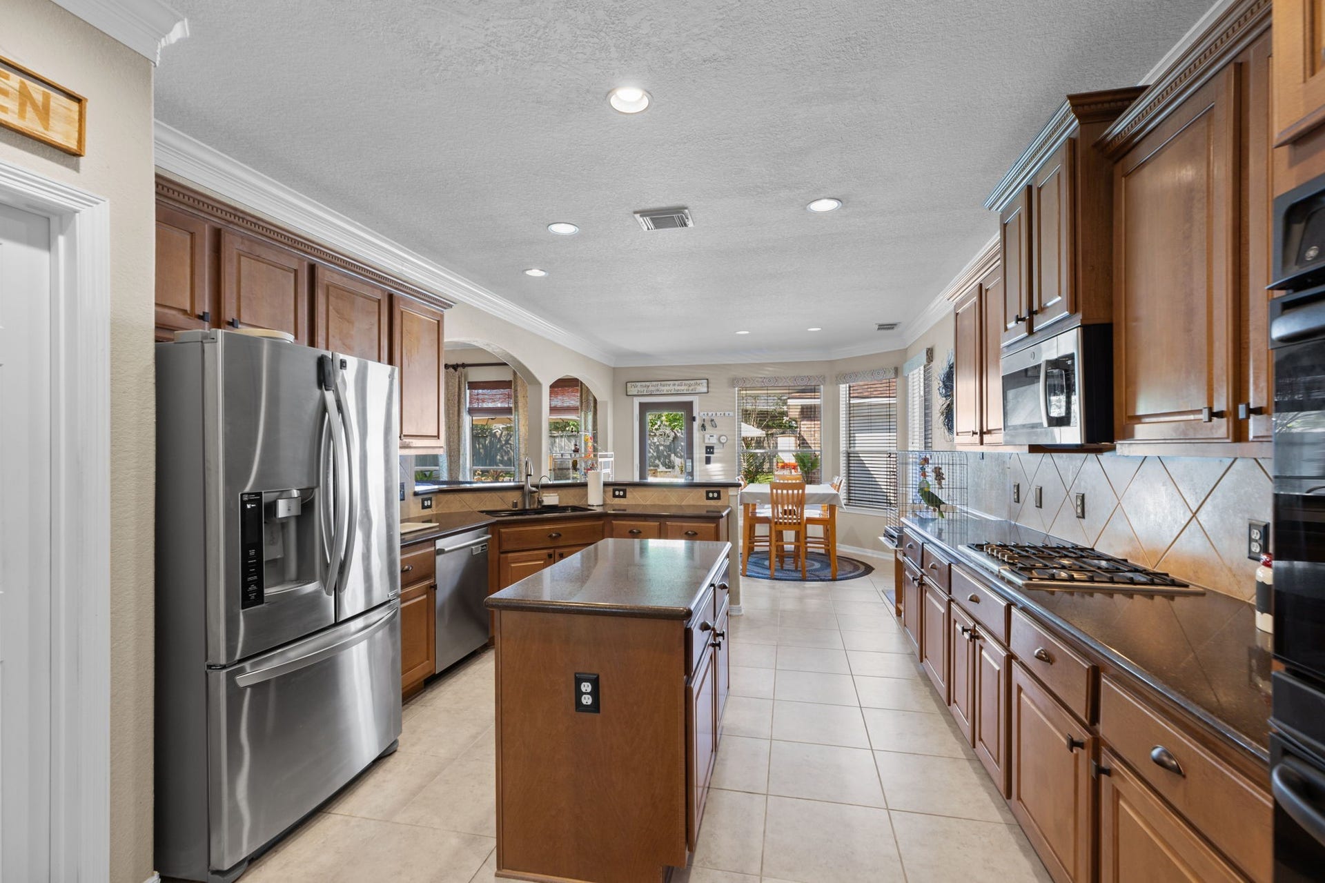 16319 Rolling View Trail, Cypress, TX 77433 The kitchen is spacious enough to allow for multiple chefs and open to the family room with great views of the pool.