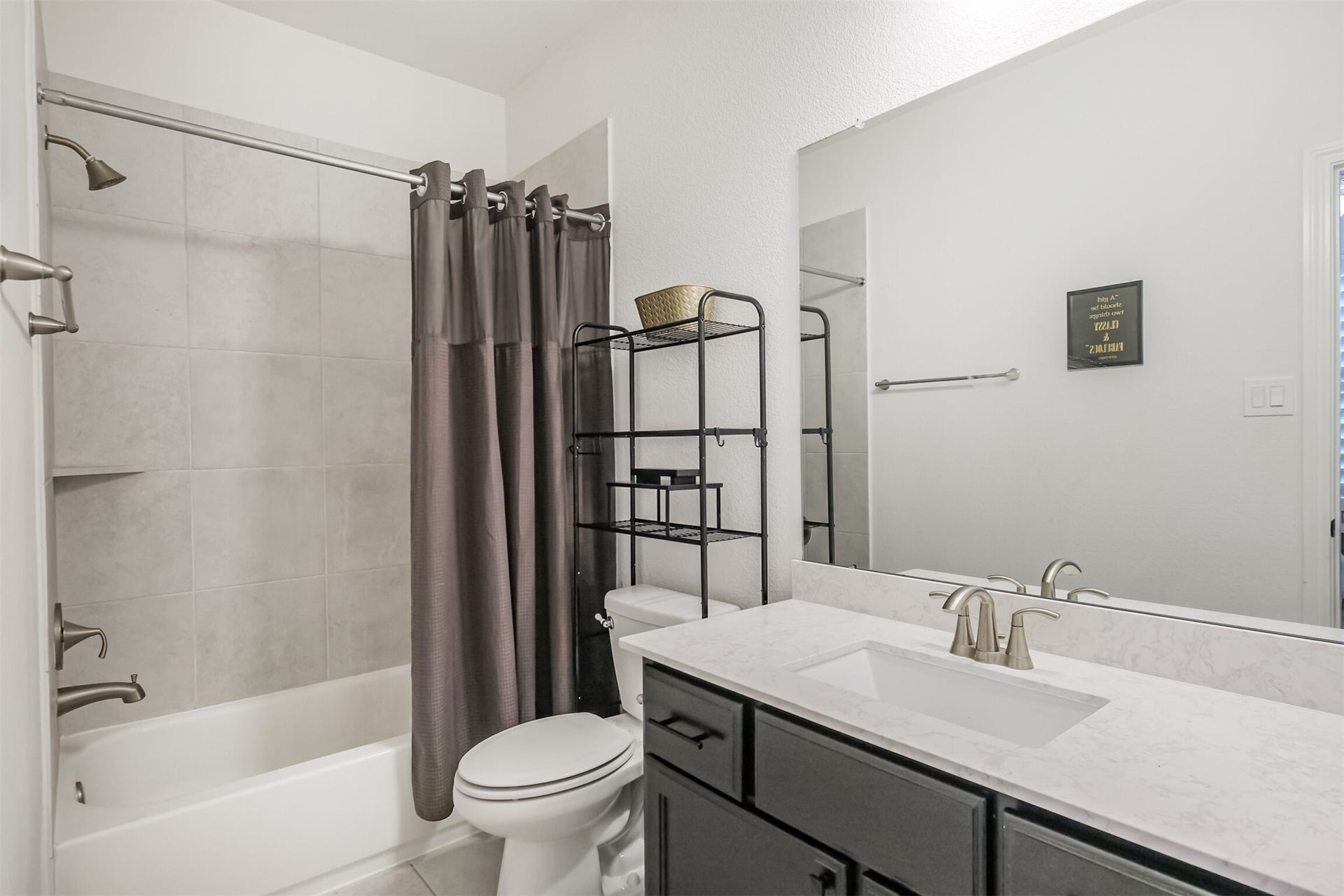 13611 Saddlebred Springs Lane, Cypress, TX 77429 Stylish sixth bathroom showcasing modern finishes, sleek quartz countertops, and chic contemporary details, creating a polished and sophisticated space.