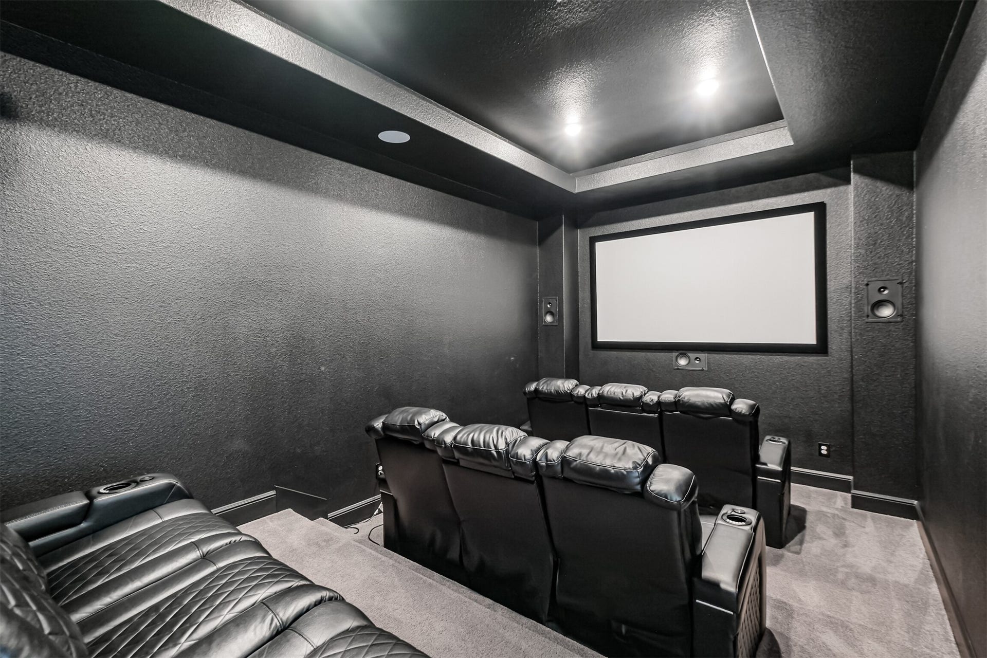 13611 Saddlebred Springs Lane, Cypress, TX 77429 Impressive dedicated media room featuring a built-in Epson Pro Cinema 4050 projector and 100 inch screen, with generous space to create the ultimate at-home theater experience. Perfect for movie nights, sporting events, and entertaining, this expansive room brings cinematic entertainment right at home.