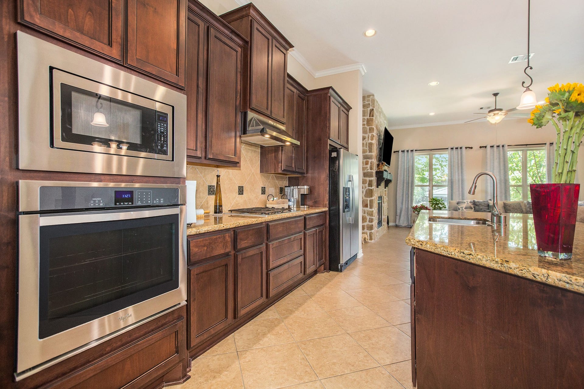 17931 Pecan Bayou Lane, Cypress, TX 77433 Fantastic kitchen features granite countertops, tile backsplash with decorative inlay, stainless steel appliances and gas cooktop.