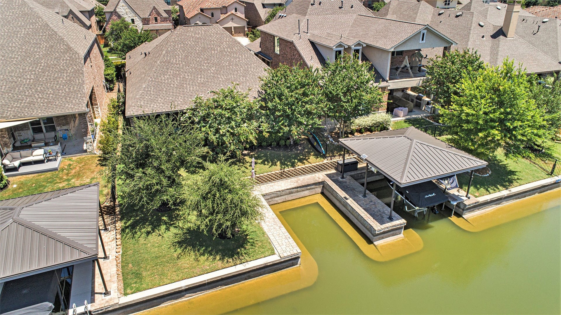 17931 Pecan Bayou Lane, Cypress, TX 77433 Aerial of shaded backyard and private boat slip.