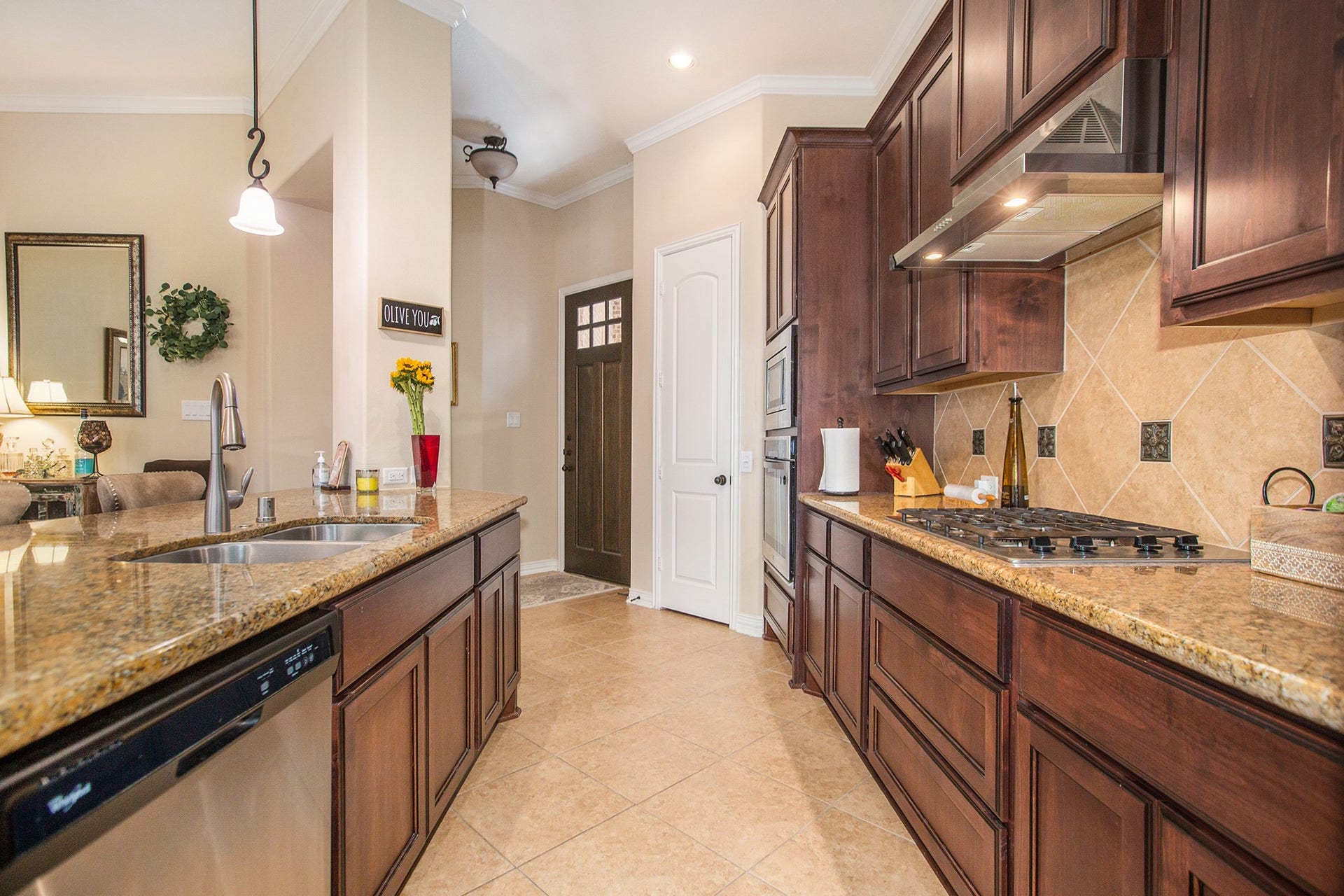 17931 Pecan Bayou Lane, Cypress, TX 77433 Crown molding, pendant lighting and walk-in pantry.
