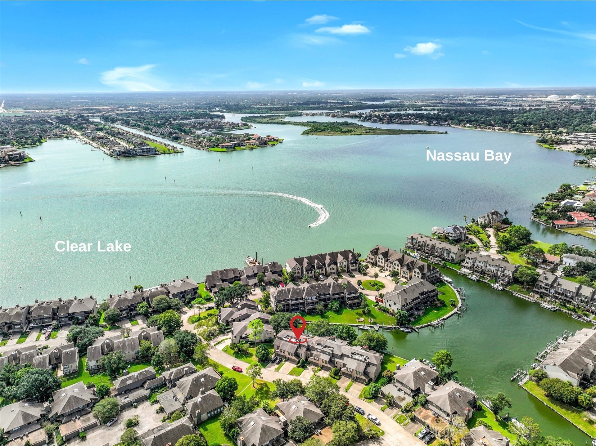 18214 Bal Harbour Drive, Nassau Bay, TX 77058 WATERFRONT LIVING IN BAL HARBOUR! This desirable canal-front townhome enjoys a prime setting along a protected canal with a 39' boat slip directly behind the home! Just beyond lies the open water of Clear Lake and Nassau Bay, offering endless opportunities for boating, sailing & enjoying the waterfront lifestyle.