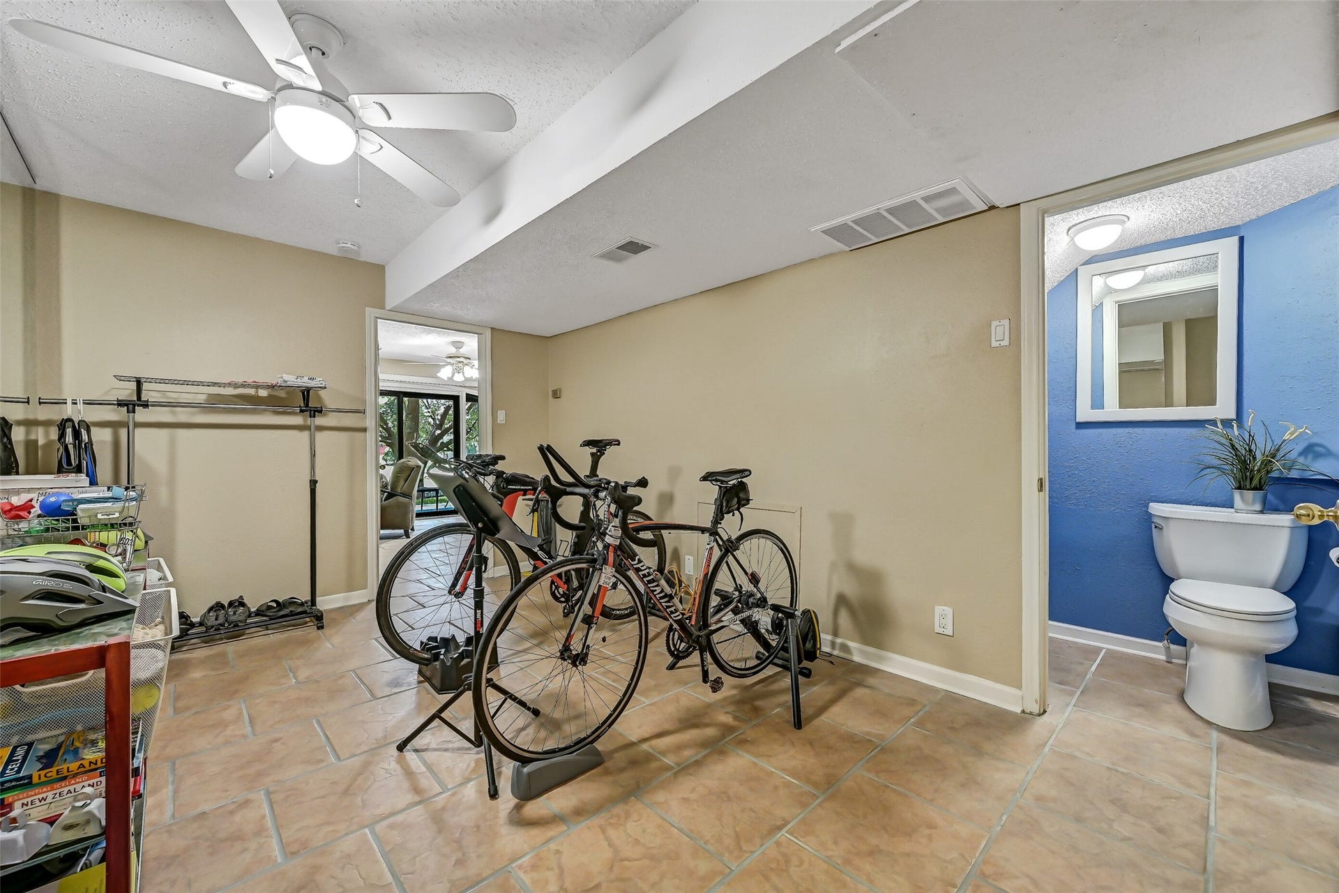 18214 Bal Harbour Drive, Nassau Bay, TX 77058 This additional ground-floor flex room offers possibilities as a fourth bedroom, workout room, hobby space or home office. Features include durable tile flooring, ceiling fan, nearby closet & convenient half bath. A separate niche is already plumbed for the potential addition of a tub or shower in the future.