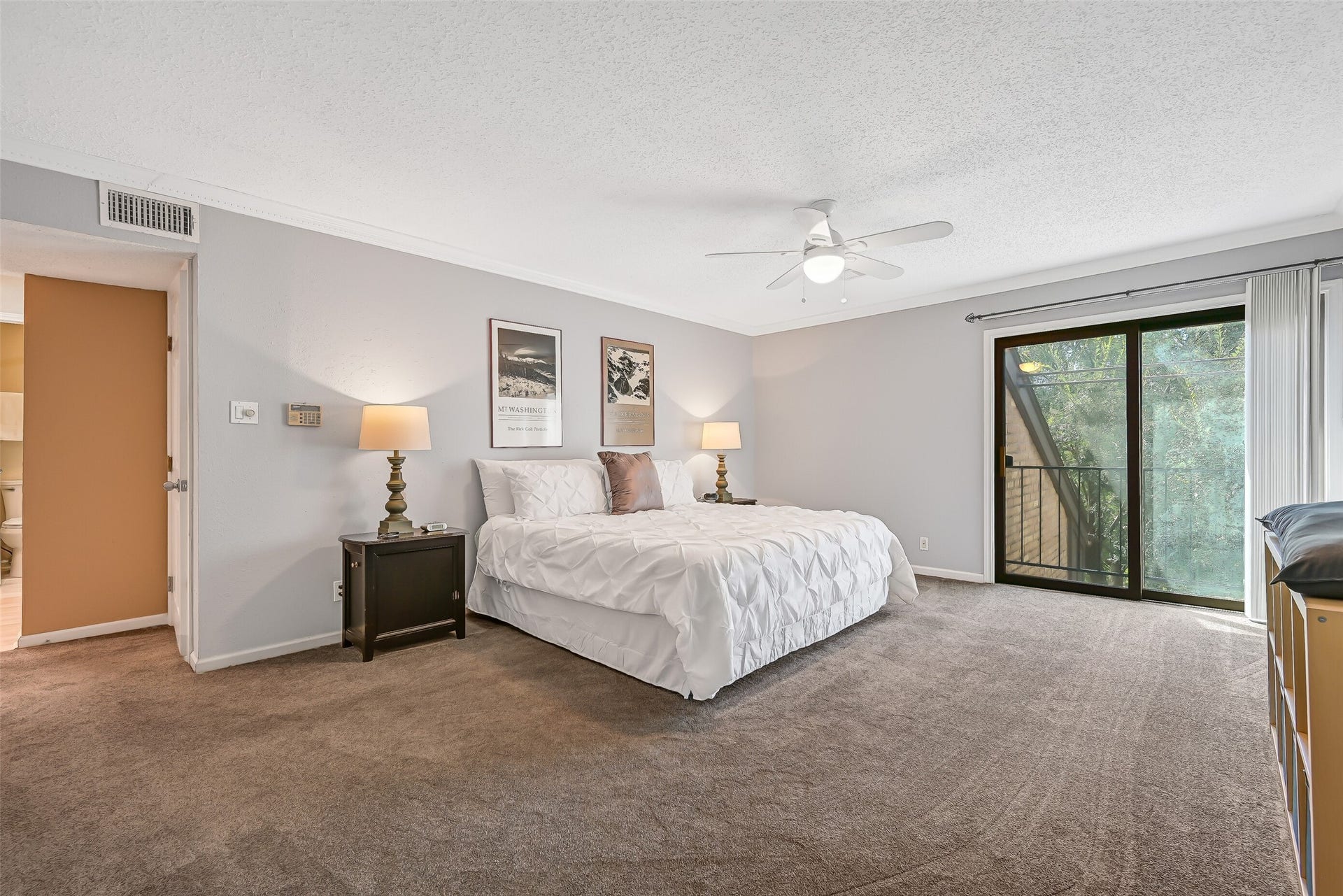 18214 Bal Harbour Drive, Nassau Bay, TX 77058 Occupying the third floor, the spacious, secluded primary suite offers privacy, room for a sitting area & sliding glass doors to a private balcony overlooking the canal. Details include upgraded stain-resistant carpeting with enhanced padding, dentil crown molding, a ceiling fan & two generous California Closets with built-in drawers.