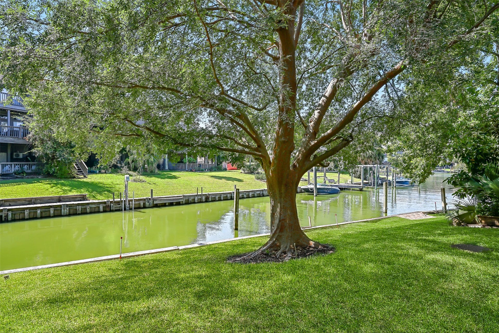 18214 Bal Harbour Drive, Nassau Bay, TX 77058 Boating enthusiasts will appreciate the included 39' boat slip with electricity, located directly behind the home along this peaceful canal. With approximately 4' of water depth reported by the seller, the slip offers convenient access to Clear Lake, Galveston Bay & beyond. A mature Chinese Elm frames the waterfront setting.