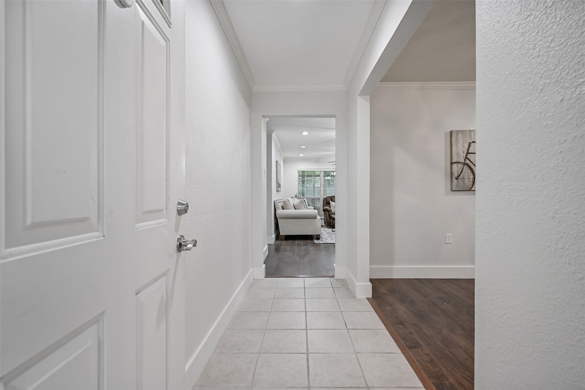5403 Carmona Lane, Pearland, TX 77584 Step through the front door into a bright, freshly painted foyer with tile flooring, crown molding & oversized baseboards. The family room is straight ahead, while a wide opening to the right leads into the flexible office or formal dining room.