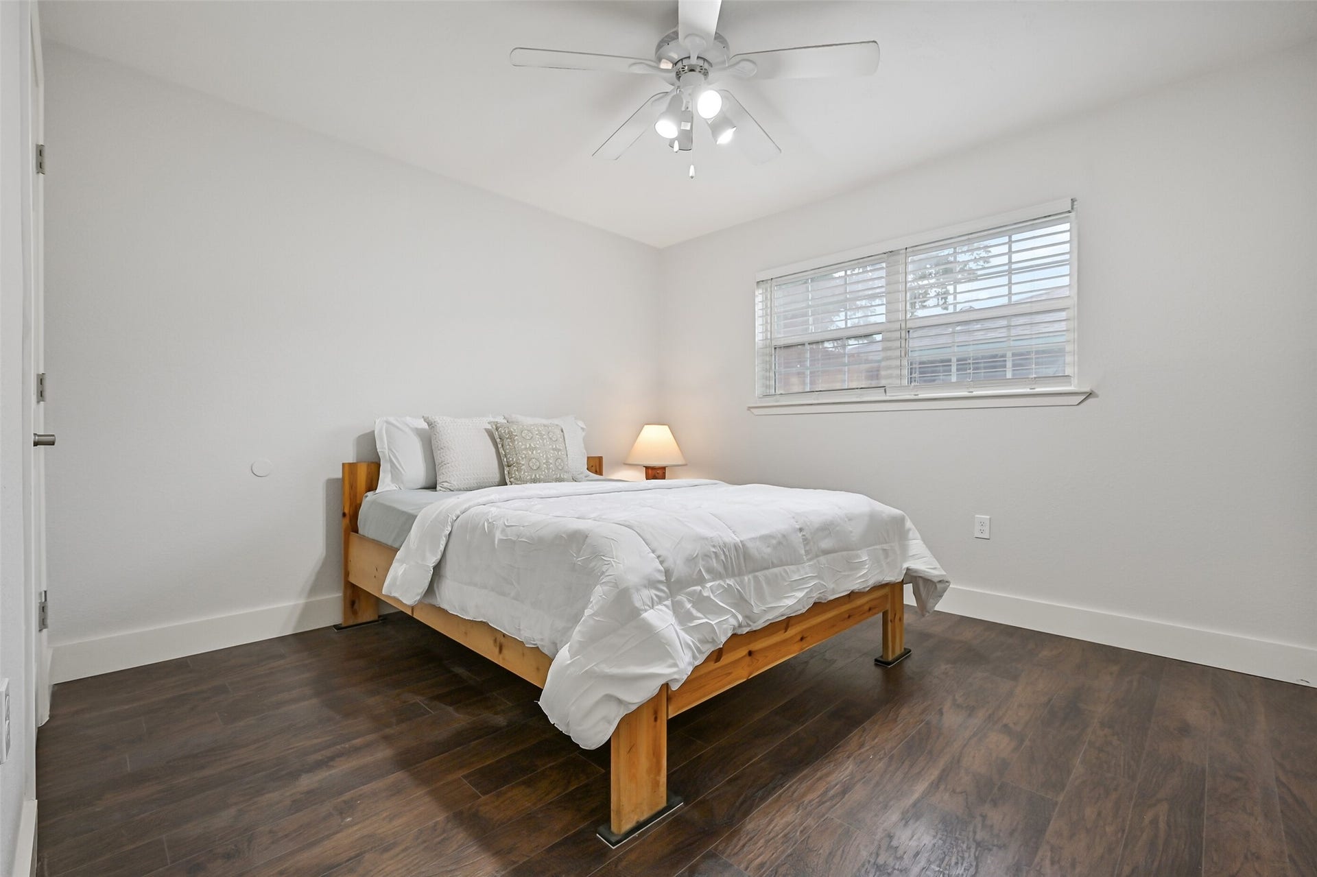 5403 Carmona Lane, Pearland, TX 77584 The split floor plan places the secondary bedrooms together on the opposite side of the home from the primary suite. This bedroom features luxury vinyl plank flooring, fresh neutral paint, a lighted ceiling fan, side-facing window & an especially roomy walk-in closet.