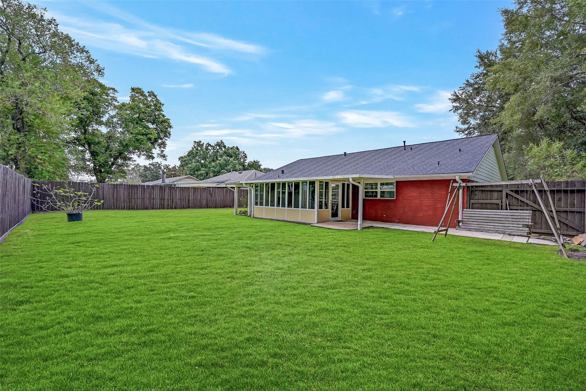 5403 Carmona Lane, Pearland, TX 77584 Plenty of room to enjoy the outdoors in this spacious fenced backyard with a broad expanse of grassy lawn, raised garden beds & no immediate rear neighbor. The screened porch is joined by an additional covered patio, providing multiple options for relaxing, grilling or spending time outside.