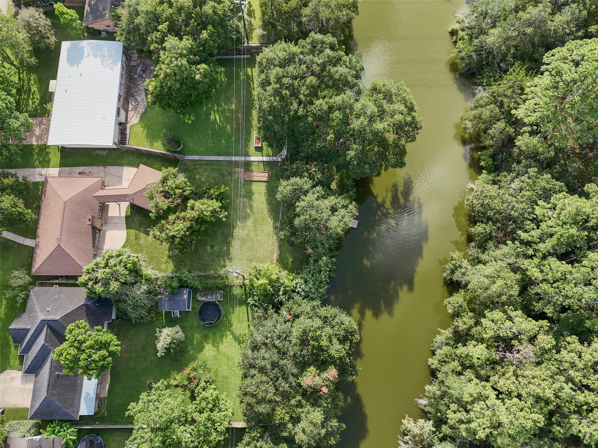 7714 Pecanwood Street, Hitchcock, TX 77563 This is home is a rare opportunity to live in a quiet neighborhood with private water access! Wish I could bring the sound of this waterfront living to you, instead, you'll have to make an appointment to experience it for yourself! You won't want to to it before it's gone, call to see it TODAY!!