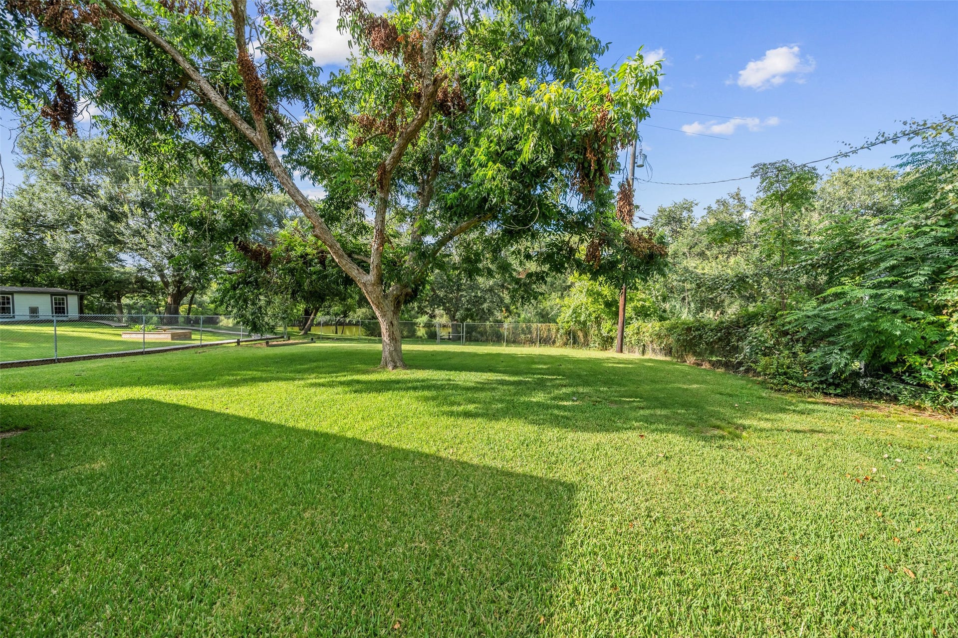 7714 Pecanwood Street, Hitchcock, TX 77563 Large, private, pet friendly yard with lot with lots of potential! Plenty of room for family, kids, and pets to play!!