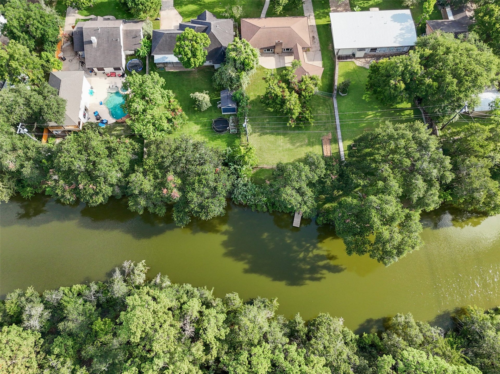 7714 Pecanwood Street, Hitchcock, TX 77563 Mature trees surrounding this quiet wooded area; plenty of waterways to explore in your boat or kayak.