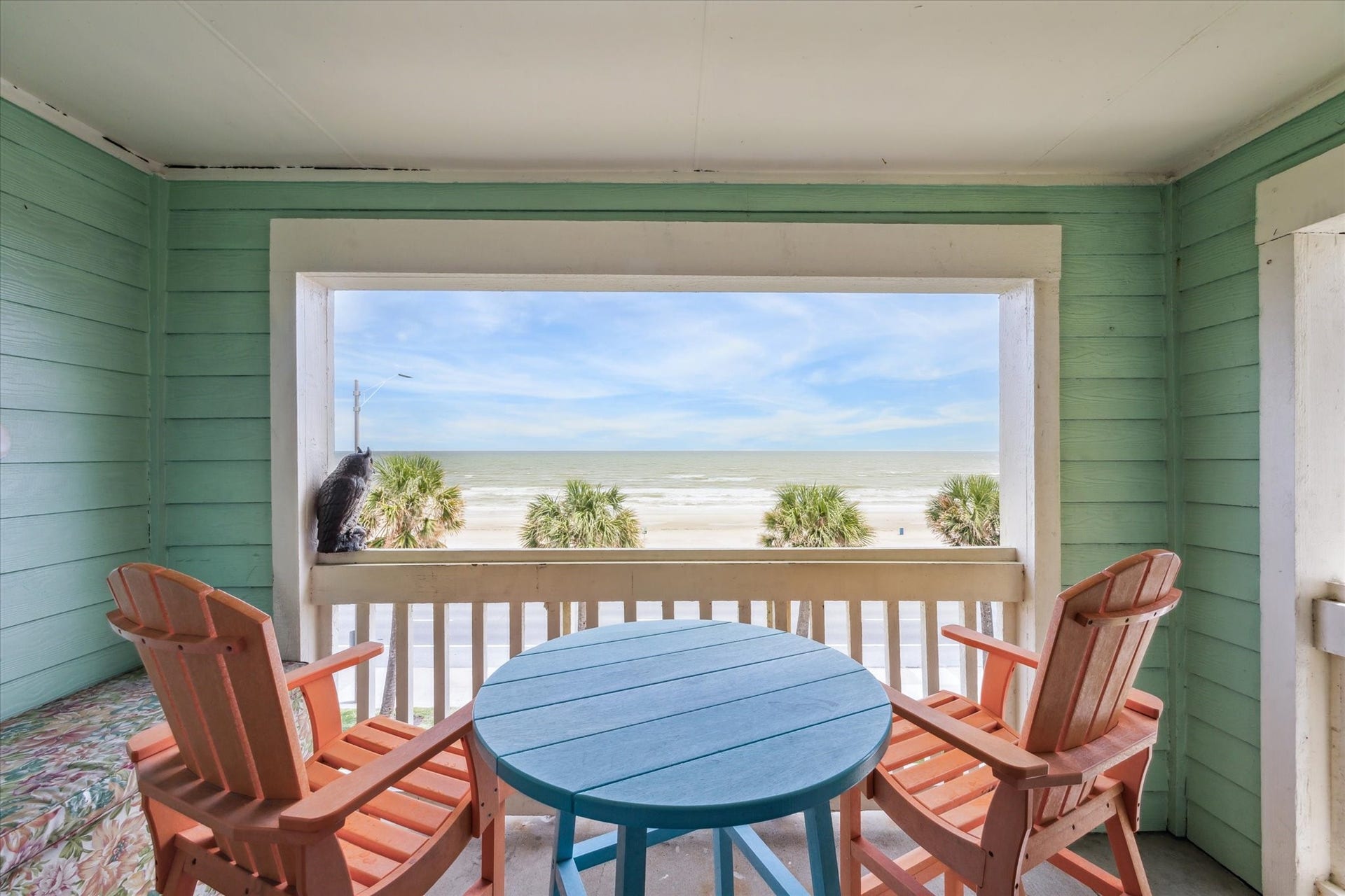 7000 Seawall Boulevard, #636, Galveston, TX 77551 This 3rd Floor Condo showcases a cozy beachfront porch with a direct view of the ocean, featuring comfortable seating and a relaxing atmosphere perfect for enjoying the seaside ambiance.