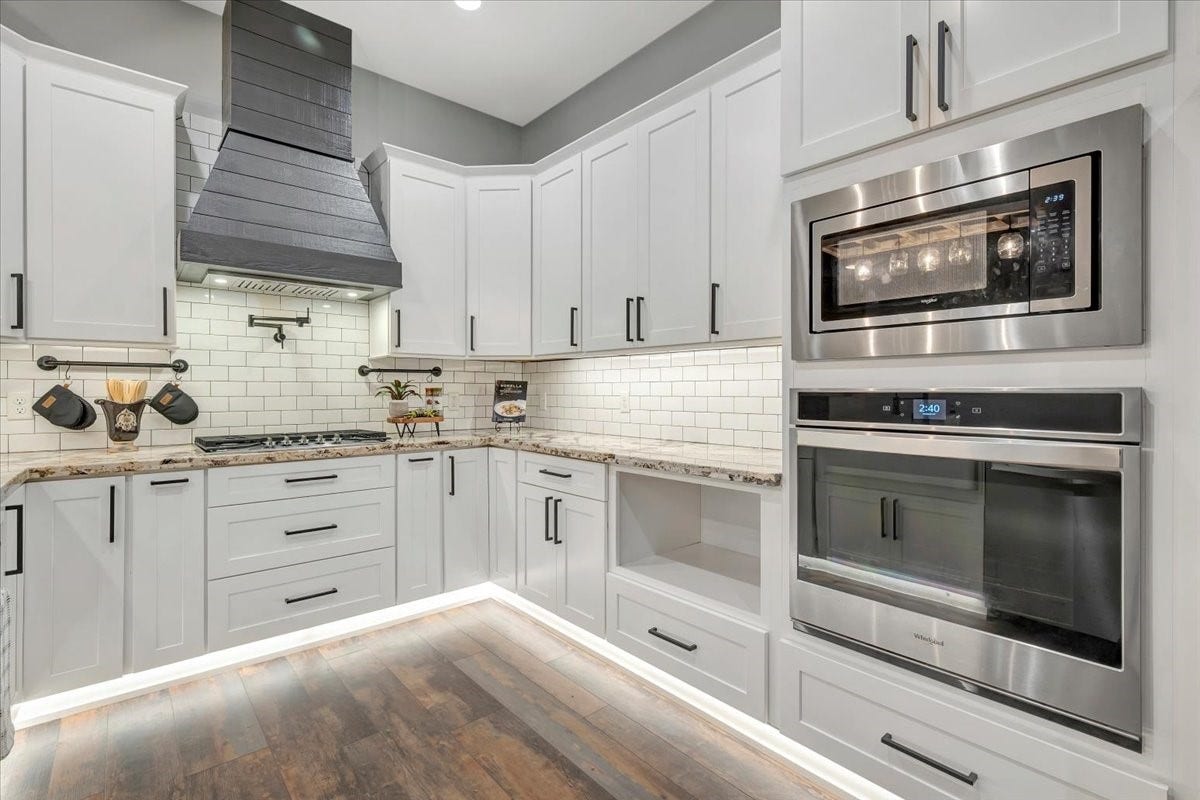 KITCHEN ALSO HAS A POT FILLER, FARM SINK, UNDER COUNTER AND UNDER CABINET LIGHTING