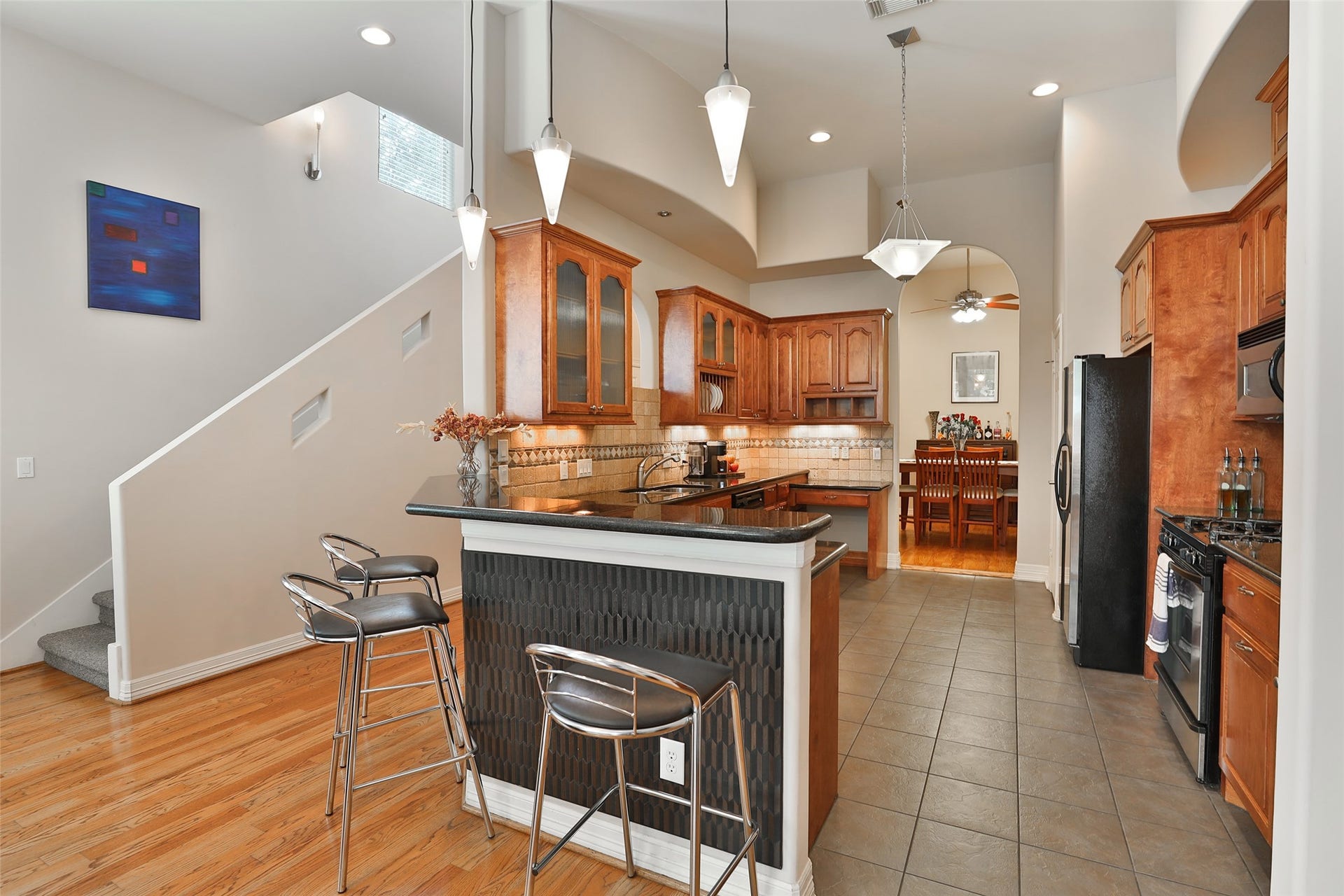 The kitchen is open to the den.