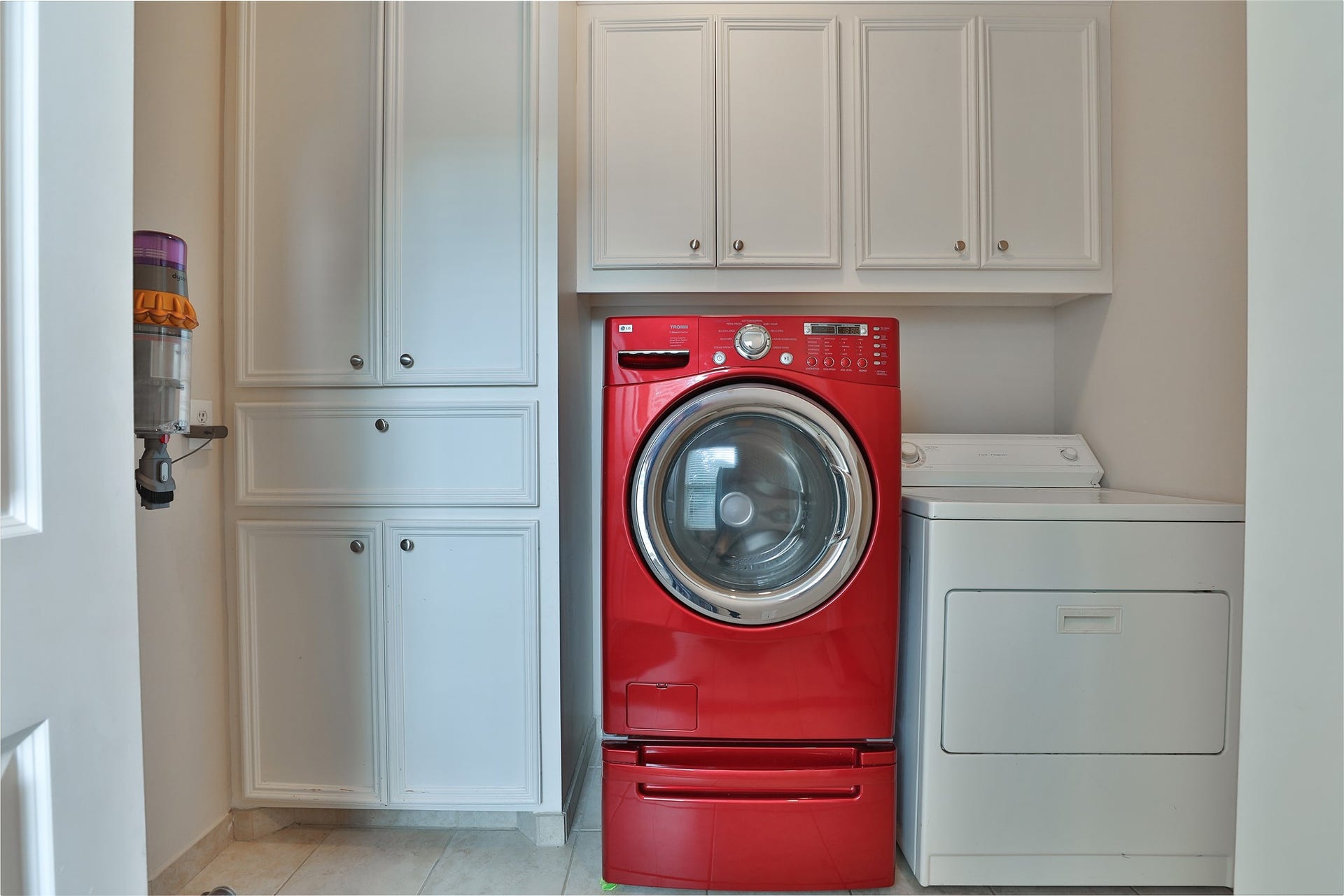 Large utility room with storage upstairs.