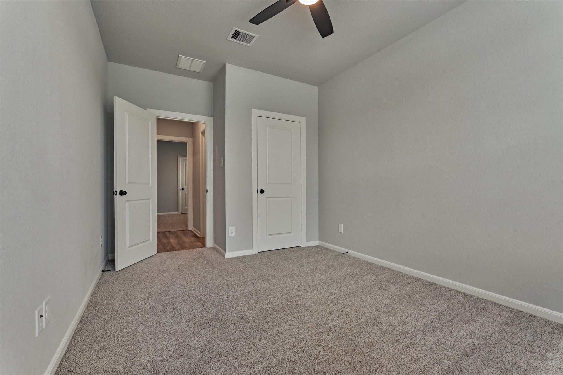 Spacious bedroom at the front of the home offers large closet for comfortable storage.