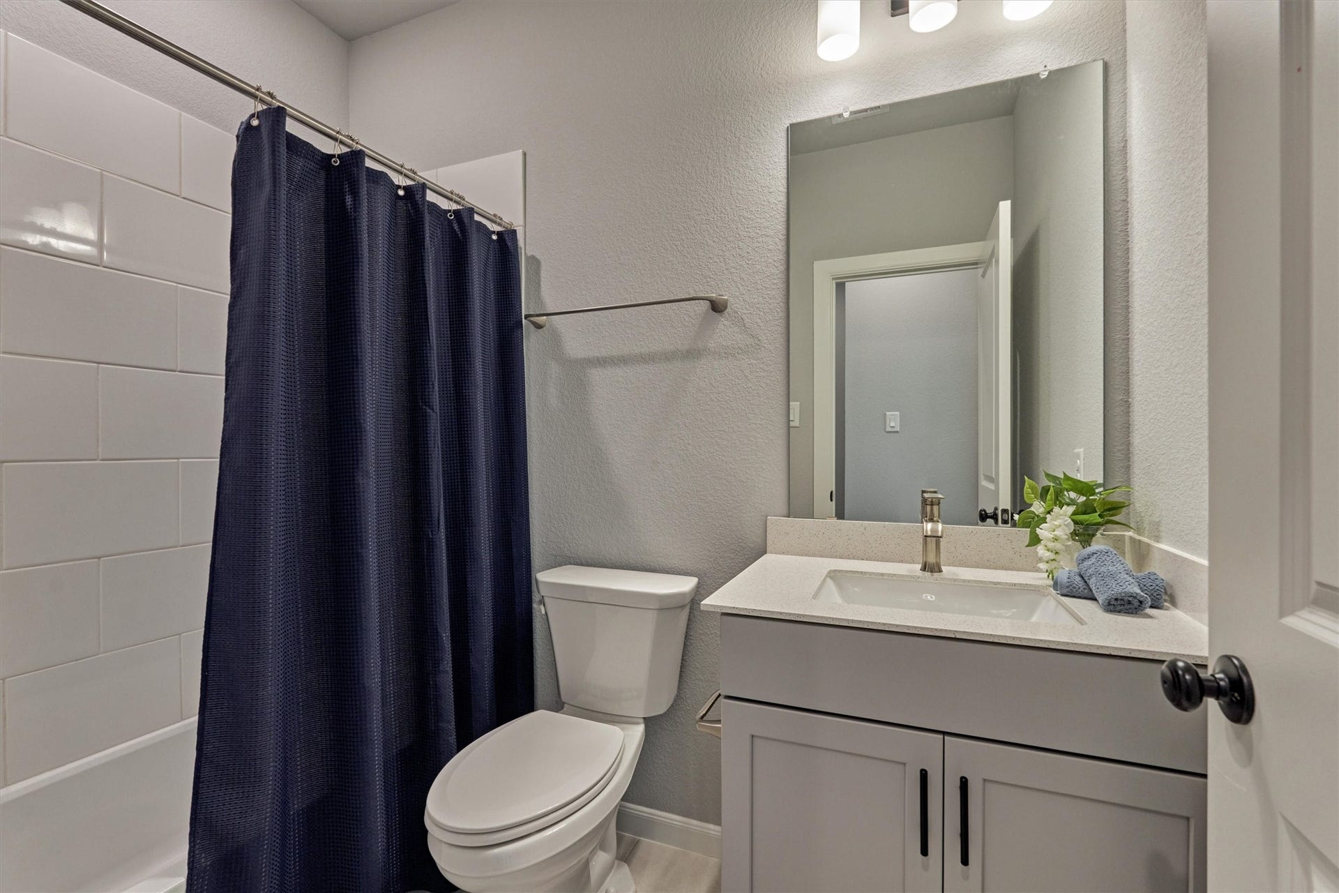Well appointed full bath with tub/shower combo serves the two secondary bedrooms at the front of the home.