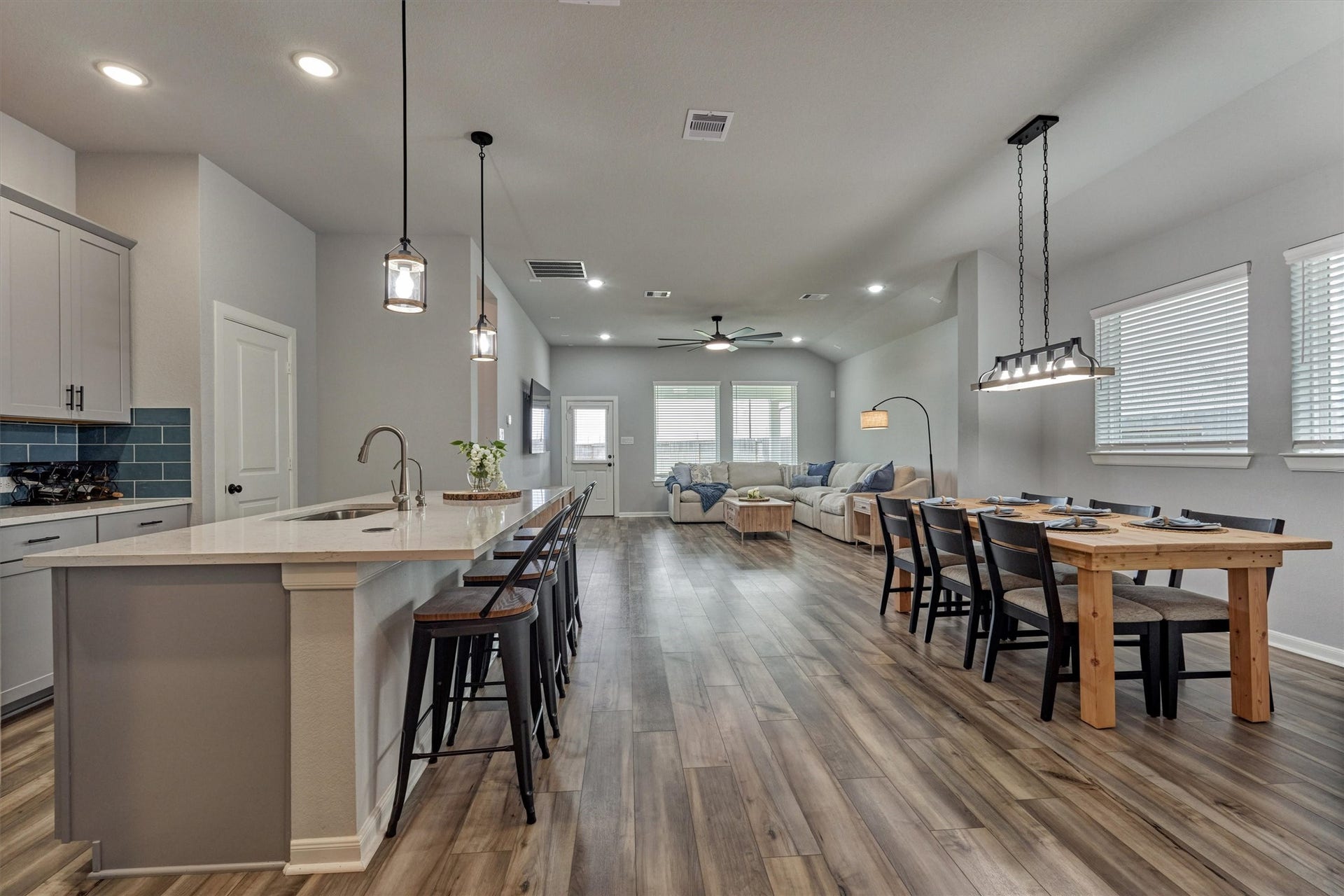 WOW! Quartz kitchen with generous island seating options and premium fixtures throughout!