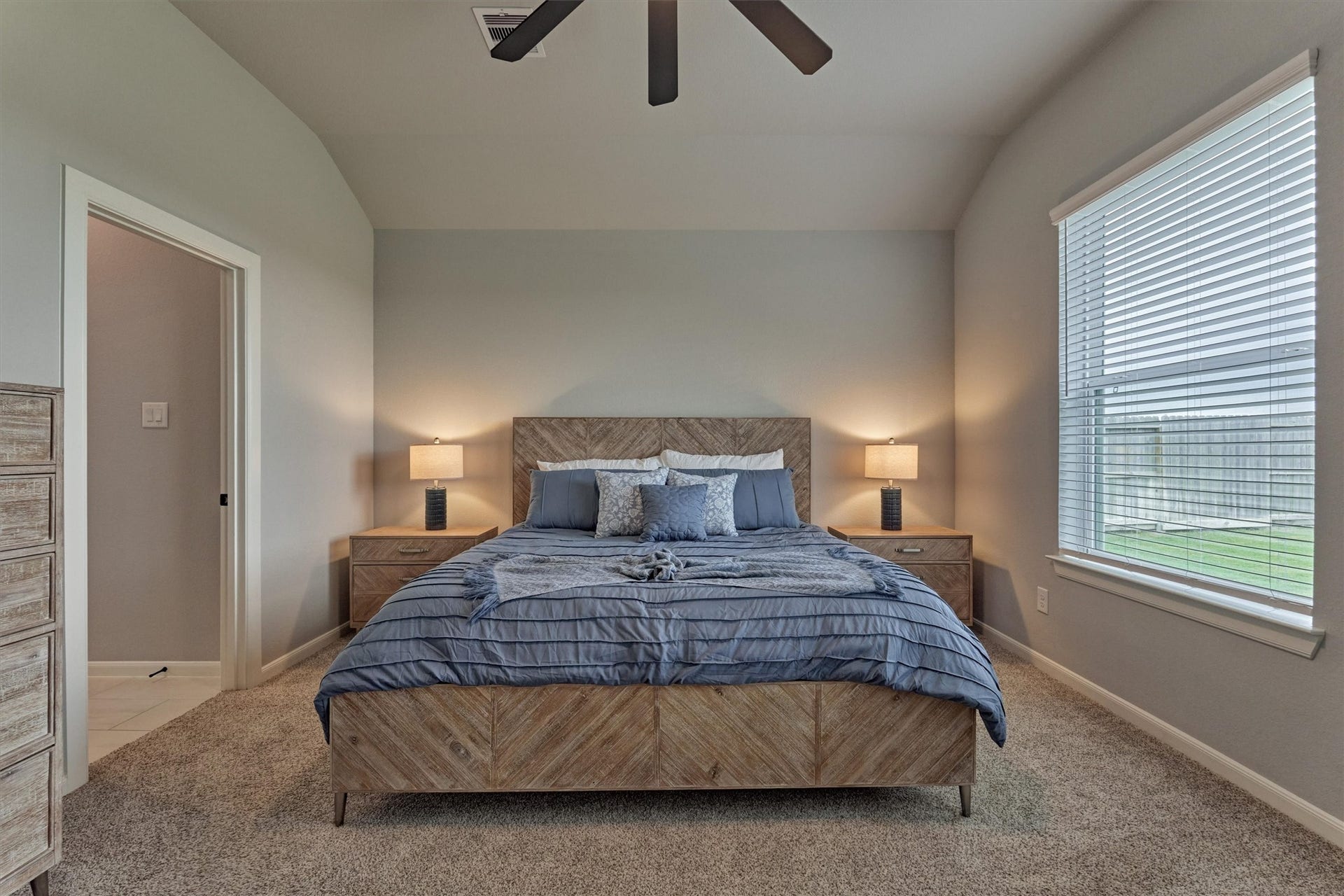 Raised ceiling, neutral color palette, and double door entry to the primary bath!