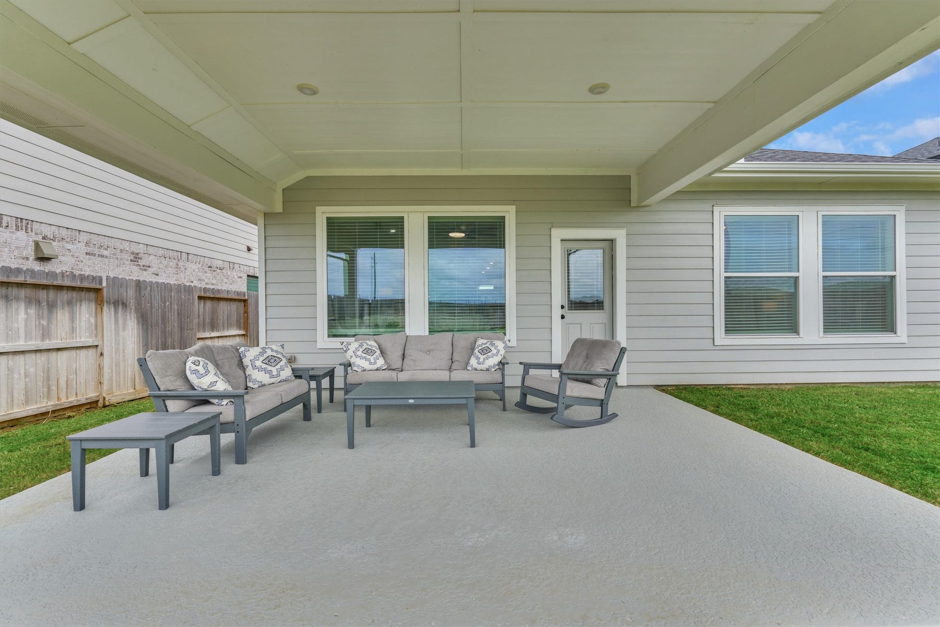 Shade is a commodity in Texas and this home has plenty under this oversized patio! Plumbed for gas!