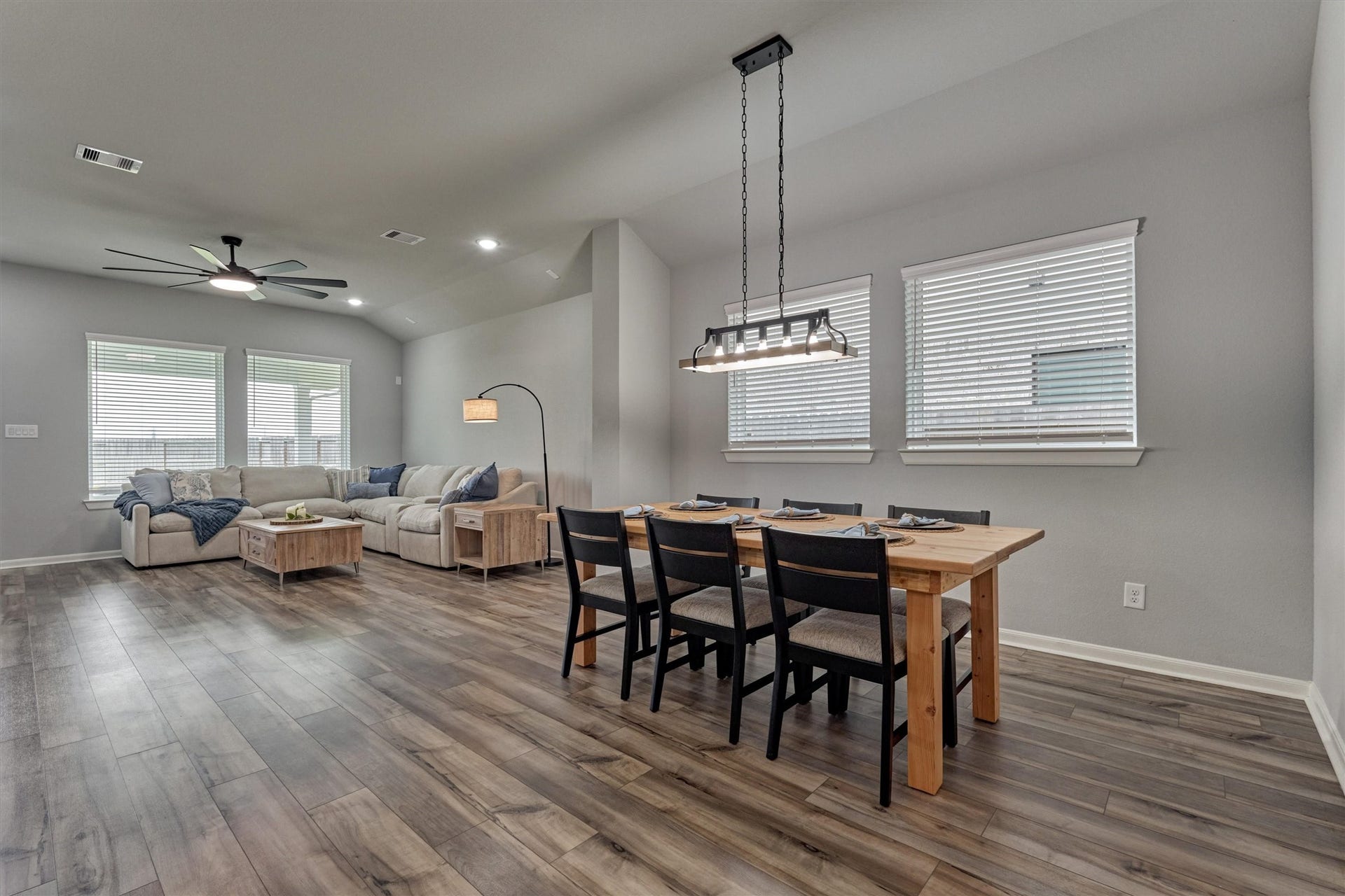 Elegant dining space is perfectly positioned and ideal for small and large gatherings! Easy access to the rear patio for grilling!
