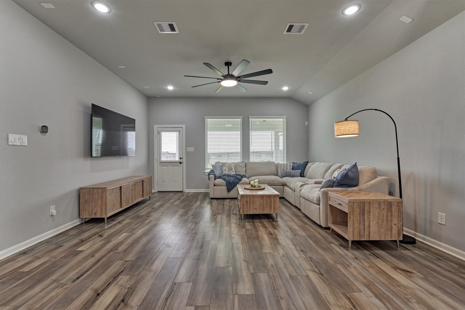 Huge living room overlooks the backyard oasis!
